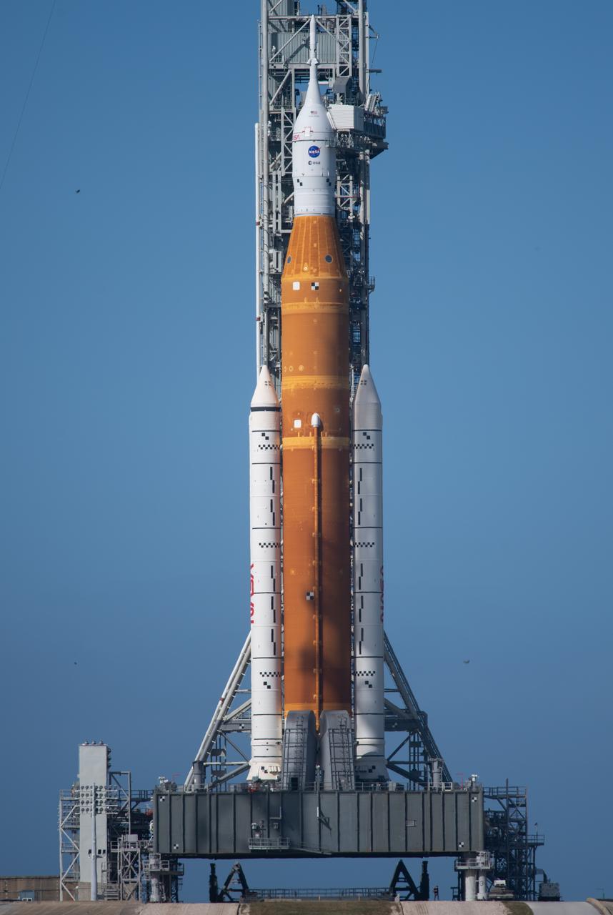 NASA’s Space Launch System (SLS) rocket with the Orion spacecraft aboard is seen atop a mobile launcher at Launch Pad 39B as preparations for launch continue, Saturday, Nov. 5, 2022, at NASA’s Kennedy Space Center in Florida. NASA’s Artemis I flight test is the first integrated test of the agency’s deep space exploration systems: the Orion spacecraft, SLS rocket, and supporting ground systems. Launch of the uncrewed flight test is targeted for Nov. 14 at 12:07 a.m. EST. Photo Credit: (NASA/Joel Kowsky)