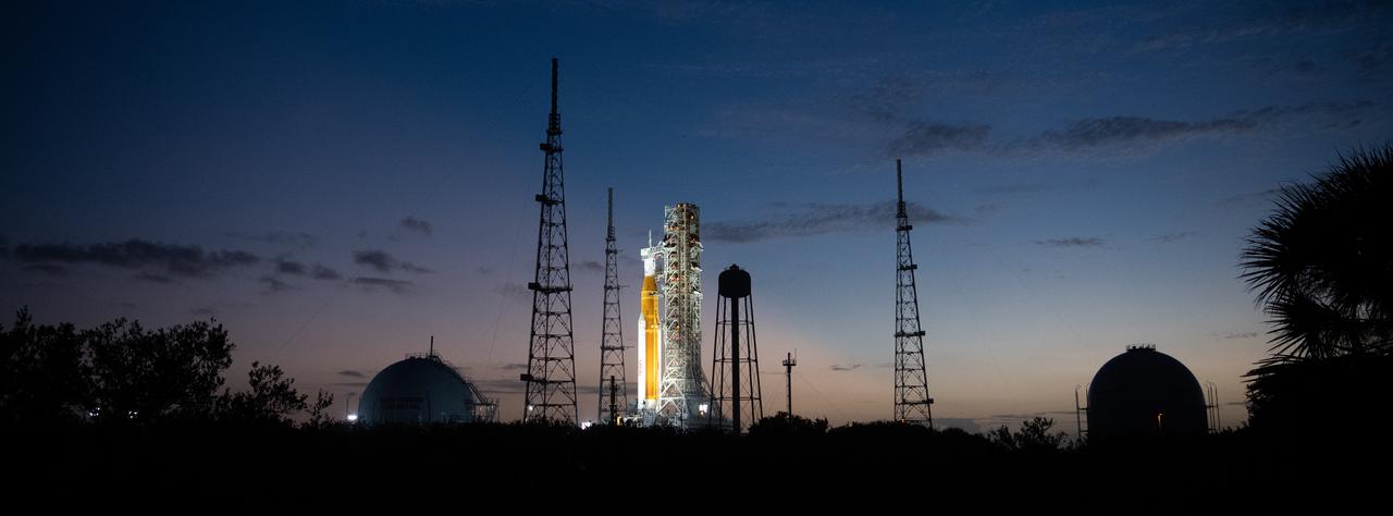 NASA’s Space Launch System (SLS) rocket with the Orion spacecraft aboard is seen illuminated by spotlights after sunset atop the mobile launcher at Launch Pad 39B as preparations for launch continue, Sunday, Nov. 6, 2022, at NASA’s Kennedy Space Center in Florida. NASA’s Artemis I flight test is the first integrated test of the agency’s deep space exploration systems: the Orion spacecraft, SLS rocket, and supporting ground systems. Launch of the uncrewed flight test is targeted for Nov. 14 at 12:07 a.m. EST. Photo Credit: (NASA/Joel Kowsky)