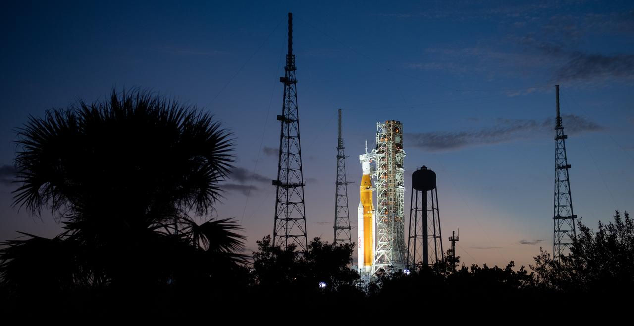 NASA’s Space Launch System (SLS) rocket with the Orion spacecraft aboard is seen illuminated by spotlights after sunset atop the mobile launcher at Launch Pad 39B as preparations for launch continue, Sunday, Nov. 6, 2022, at NASA’s Kennedy Space Center in Florida. NASA’s Artemis I flight test is the first integrated test of the agency’s deep space exploration systems: the Orion spacecraft, SLS rocket, and supporting ground systems. Launch of the uncrewed flight test is targeted for Nov. 14 at 12:07 a.m. EST. Photo Credit: (NASA/Joel Kowsky)