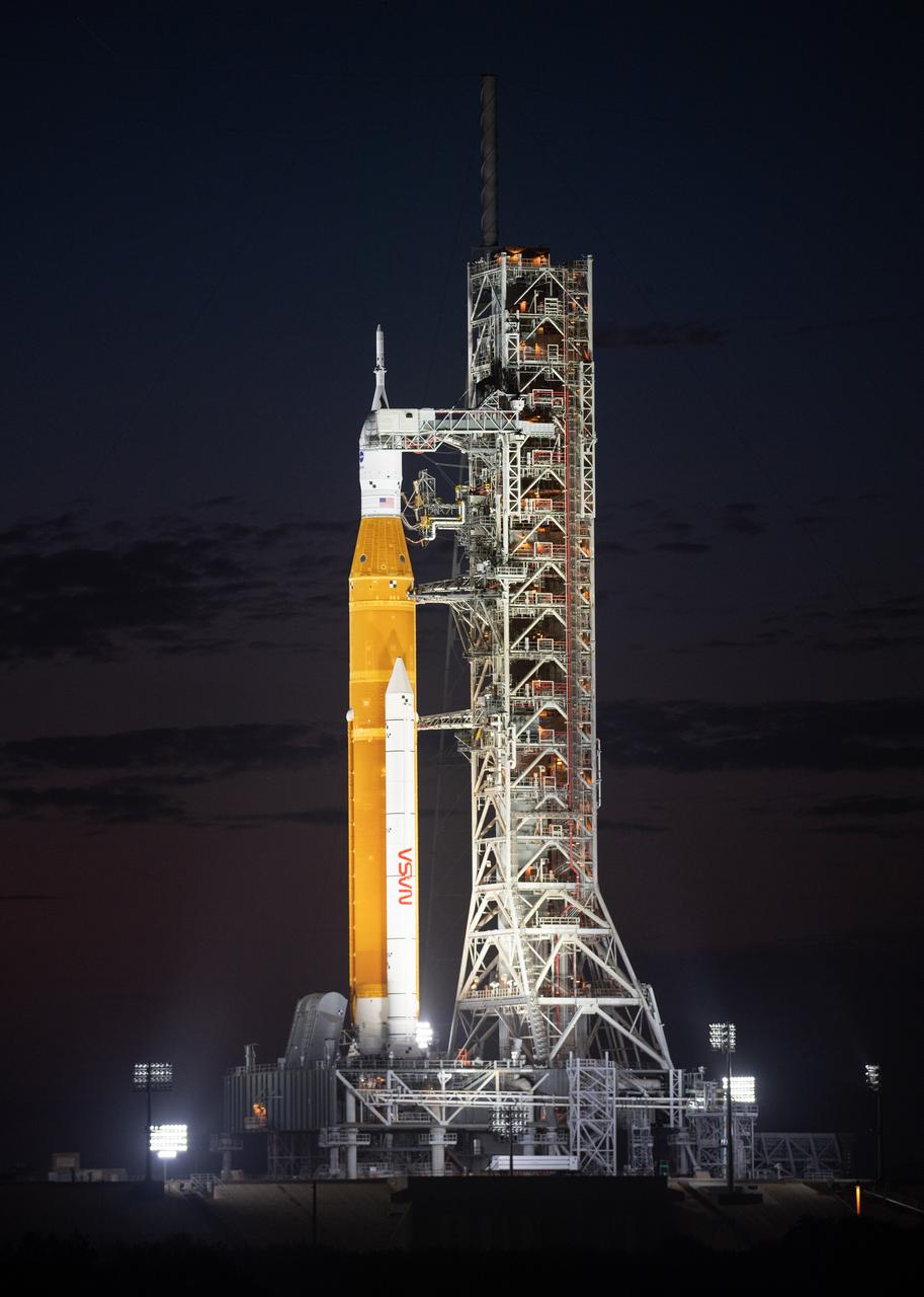 NASA’s Space Launch System (SLS) rocket with the Orion spacecraft aboard is seen illuminated by spotlights atop the mobile launcher at Launch Pad 39B as preparations for launch continue, Sunday, Nov. 6, 2022, at NASA’s Kennedy Space Center in Florida. NASA’s Artemis I flight test is the first integrated test of the agency’s deep space exploration systems: the Orion spacecraft, SLS rocket, and supporting ground systems. Launch of the uncrewed flight test is targeted for Nov. 14 at 12:07 a.m. EST. Photo Credit: (NASA/Joel Kowsky)