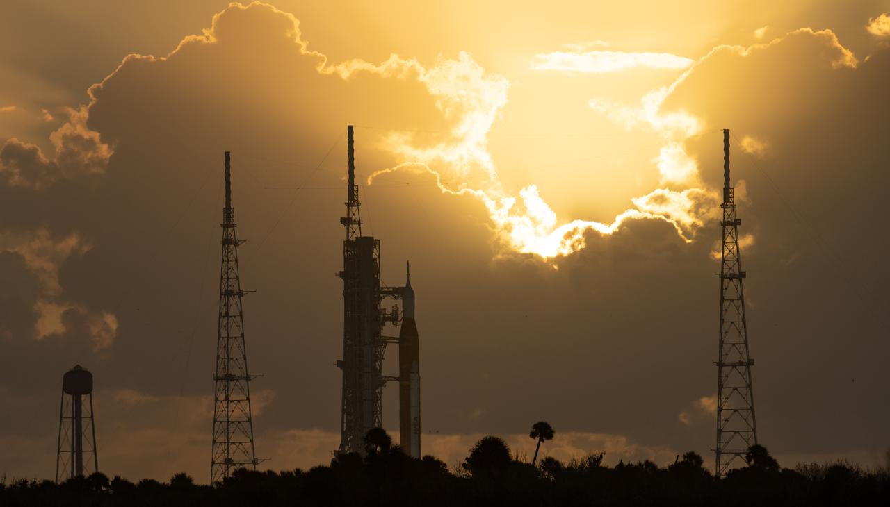 NASA’s Space Launch System (SLS) rocket with the Orion spacecraft aboard is seen at sunrise atop the mobile launcher at Launch Pad 39B as preparations for launch continue, Monday, Nov. 7, 2022, at NASA’s Kennedy Space Center in Florida. NASA’s Artemis I flight test is the first integrated test of the agency’s deep space exploration systems: the Orion spacecraft, SLS rocket, and supporting ground systems. Launch of the uncrewed flight test is targeted for Nov. 14 at 12:07 a.m. EST. Photo Credit: (NASA/Joel Kowsky)