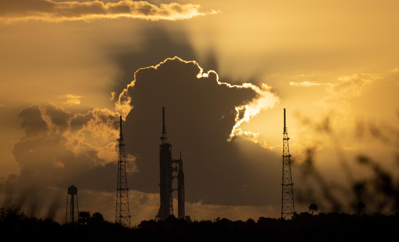 NASA’s Space Launch System (SLS) rocket with the Orion spacecraft aboard is seen at sunrise atop the mobile launcher at Launch Pad 39B as preparations for launch continue, Monday, Nov. 7, 2022, at NASA’s Kennedy Space Center in Florida. NASA’s Artemis I flight test is the first integrated test of the agency’s deep space exploration systems: the Orion spacecraft, SLS rocket, and supporting ground systems. Launch of the uncrewed flight test is targeted for Nov. 14 at 12:07 a.m. EST. Photo Credit: (NASA/Joel Kowsky)