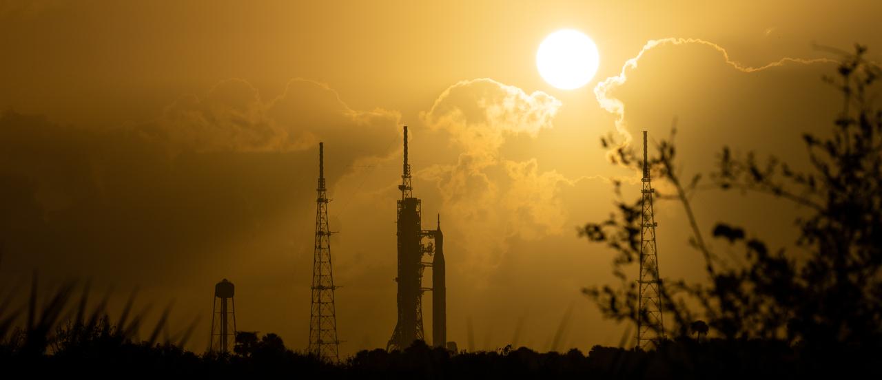 NASA’s Space Launch System (SLS) rocket with the Orion spacecraft aboard is seen at sunrise atop the mobile launcher at Launch Pad 39B as preparations for launch continue, Monday, Nov. 7, 2022, at NASA’s Kennedy Space Center in Florida. NASA’s Artemis I flight test is the first integrated test of the agency’s deep space exploration systems: the Orion spacecraft, SLS rocket, and supporting ground systems. Launch of the uncrewed flight test is targeted for Nov. 14 at 12:07 a.m. EST. Photo Credit: (NASA/Joel Kowsky)