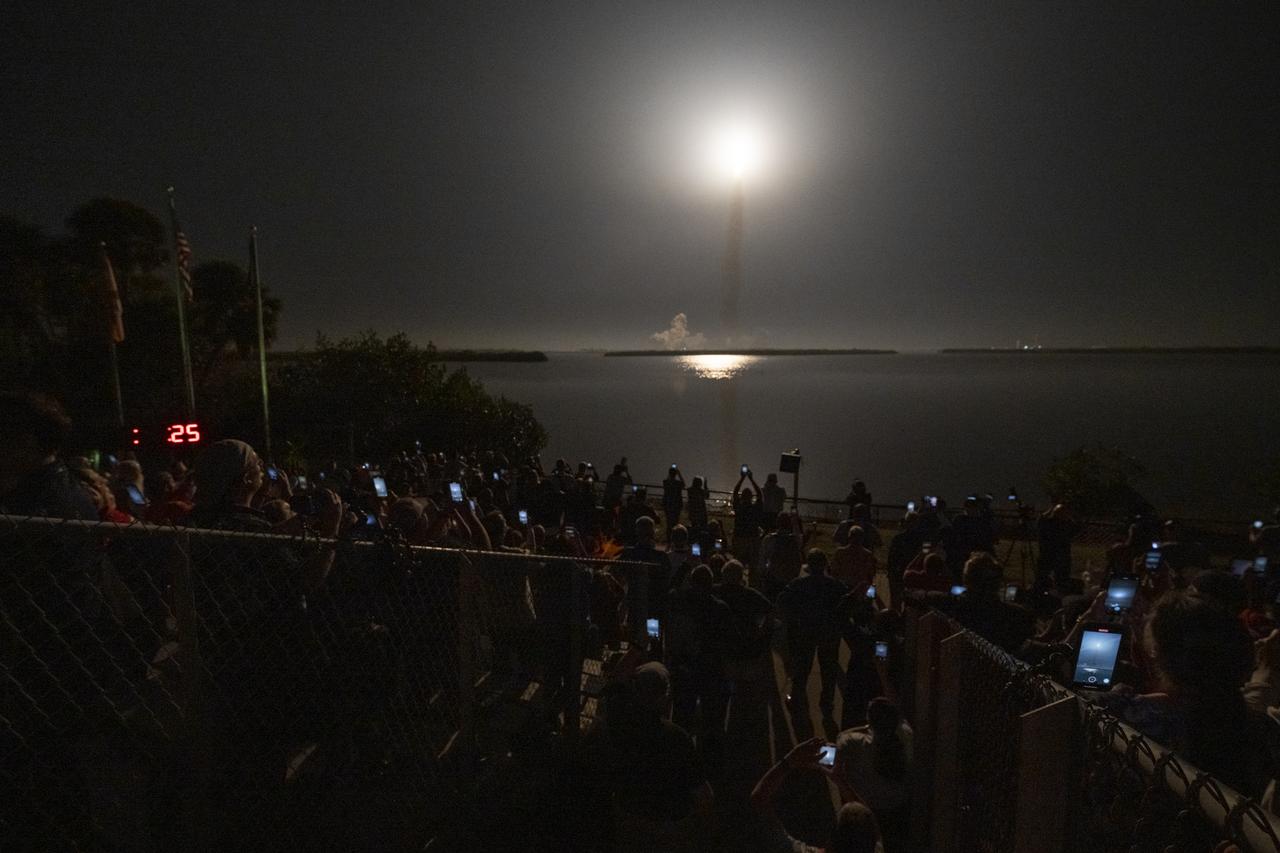 Guests at the Banana Creek viewing site watch the launch of NASA’s Space Launch System rocket carrying the Orion spacecraft on the Artemis I flight test, Wednesday, Nov. 16, 2022, at NASA’s Kennedy Space Center in Florida. NASA’s Artemis I flight test is the first integrated flight test of the agency’s deep space exploration systems: the Orion spacecraft, Space Launch System (SLS) rocket, and ground systems. SLS and Orion launched at 1:47 a.m. EST, from Launch Pad 39B at the Kennedy Space Center. Photo Credit: (NASA/Keegan Barber)