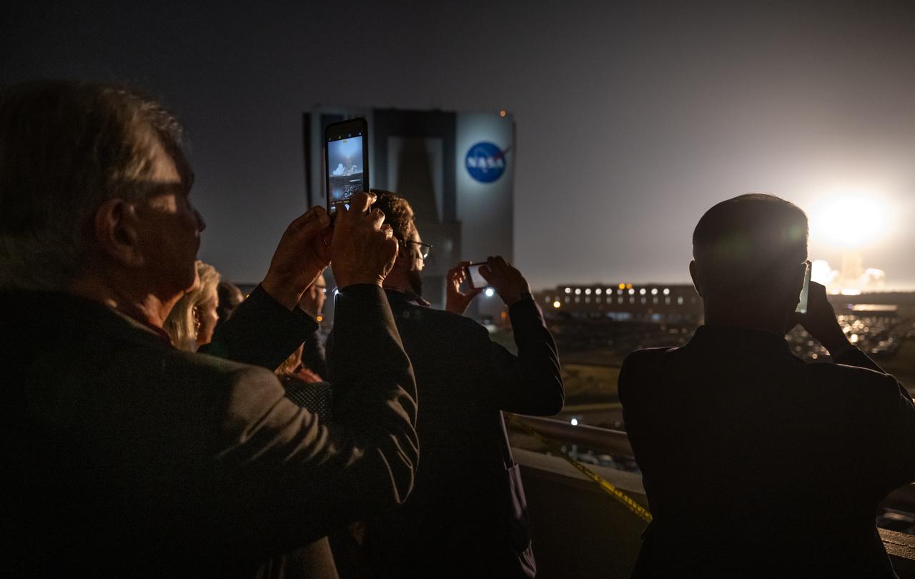 Guests watch the launch of NASA’s Space Launch System rocket carrying the Orion spacecraft on the Artemis I flight test, Wednesday, Nov. 16, 2022, from Operations and Support Building II at NASA’s Kennedy Space Center in Florida. NASA’s Artemis I flight test is the first integrated flight test of the agency’s deep space exploration systems: the Orion spacecraft, Space Launch System (SLS) rocket, and ground systems. SLS and Orion launched at 1:47 a.m. EST, from Launch Pad 39B at the Kennedy Space Center. Photo Credit: (NASA/Bill Ingalls)