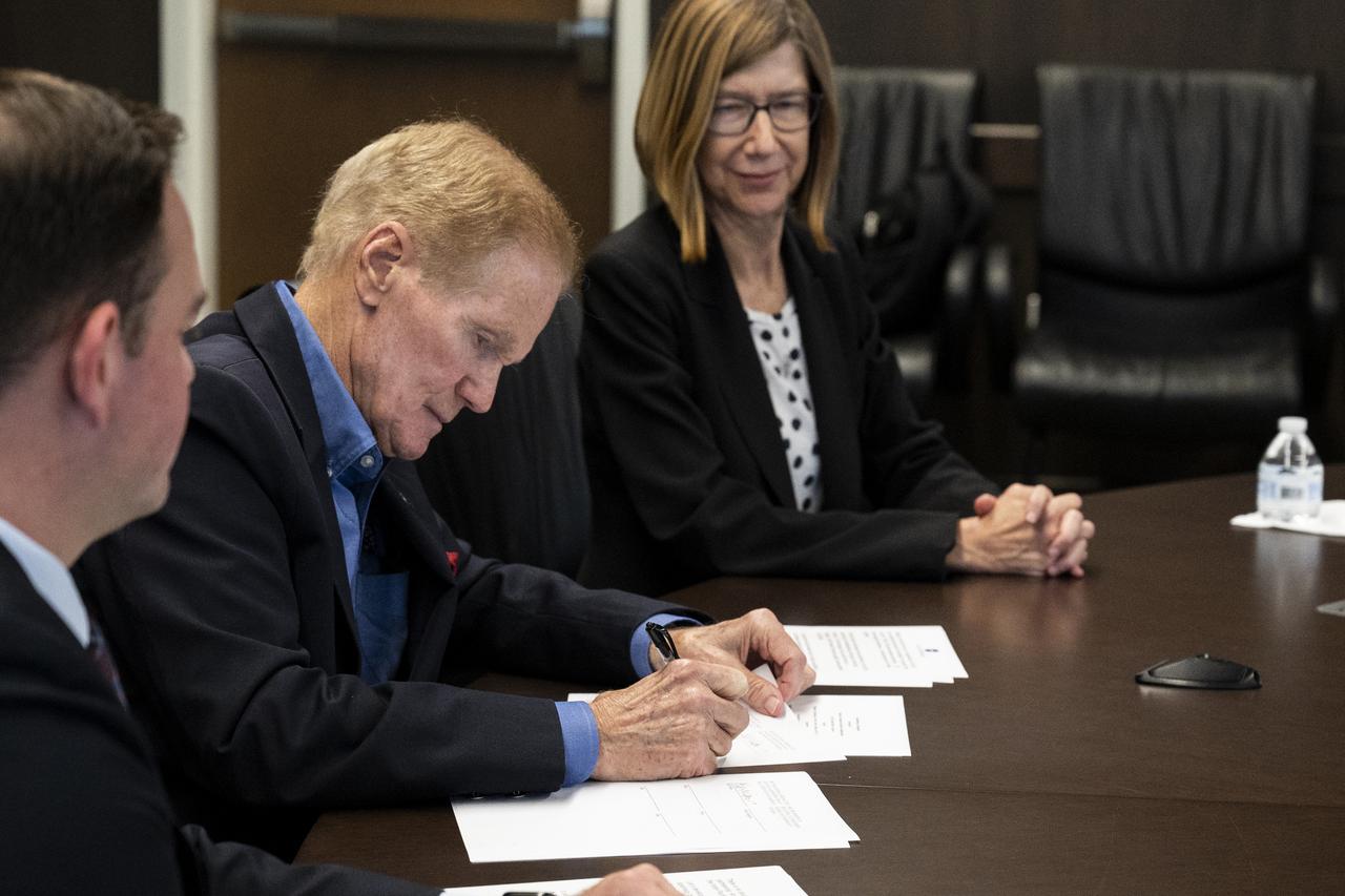 NASA Administrator Bill Nelson, joined by NASA Leadership, signs a Gateway implementing agreement during a virtual meeting hosted by Japanese Minister of Education, Culture, Sports, Science and Technology (MEXT) Keiko Nagaoka Thursday, Nov. 17, 2022, at NASA’s Kennedy Space Center in Florida. Photo Credit: (NASA/Keegan Barber)