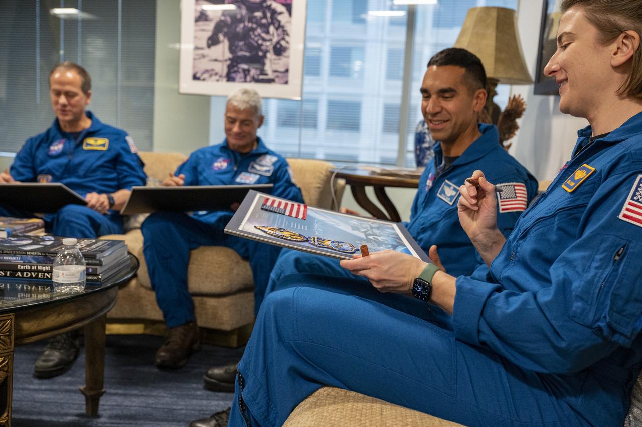 NASA’s SpaceX Crew-3 astronauts Raja Chari, Kayla Barron, Tom Marshburn, and Mark Vande Hei sign montages for NASA leadership, Wednesday, Dec. 7, 2022, at the Mary W. Jackson NASA Headquarters Building in Washington. Photo Credit: (NASA/Keegan Barber)