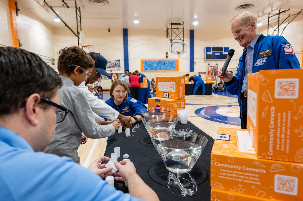 NASA Administrator Bill Nelson, right, and NASA astronaut Kayla Barron, center, participate in STEM demonstrations with students during a visit along with NASA astronauts Raja Chari, Tom Marshburn, and Mark Vande Hei, to Amidon-Bowen Elementary School, Thursday, Dec. 8, 2022, in Washington. Vande Hei spent 355 days in space as a member of Expedition 65/66 and was joined during Expedition 66 by Marshburn, Chari, and Barron who spent 177 days onboard the International Space Station. Photo Credit: (NASA/Keegan Barber)