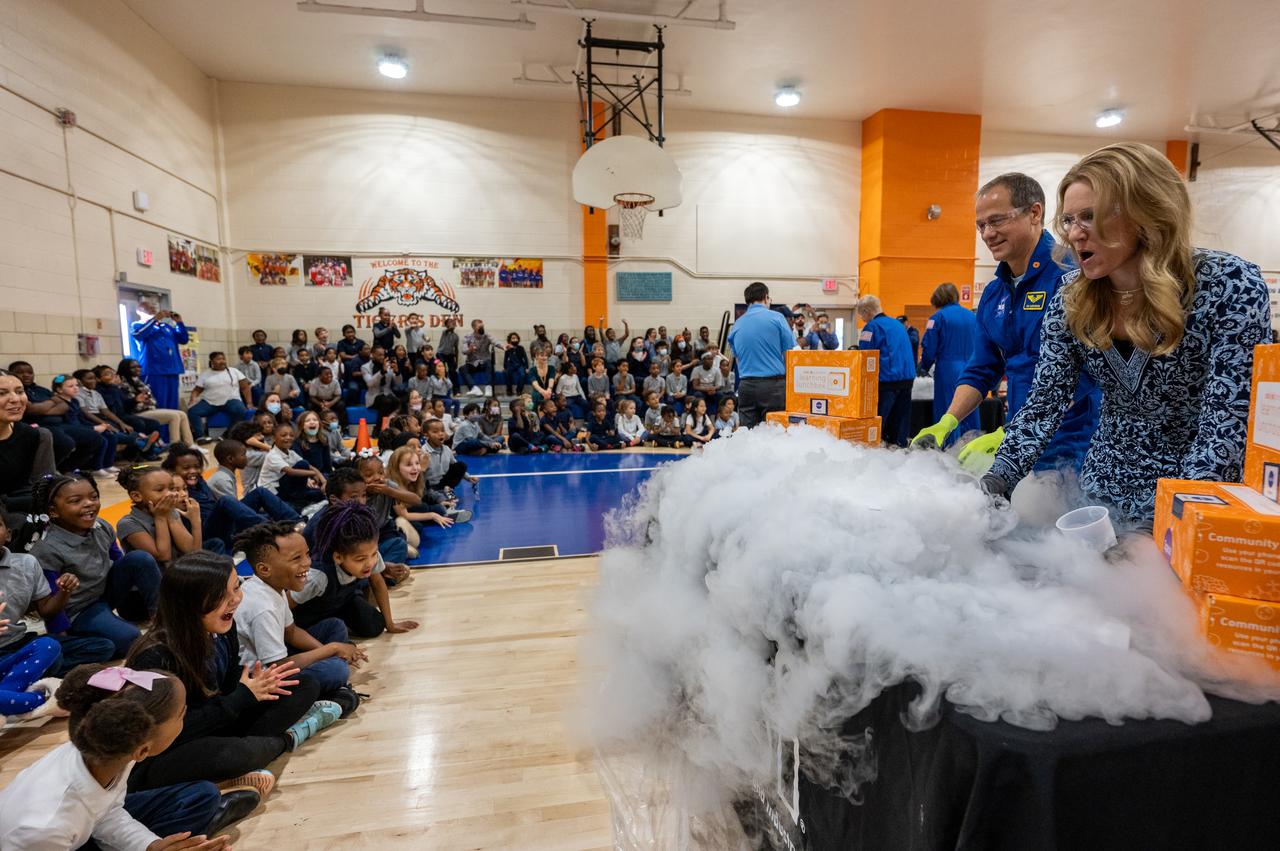 NASA astronaut Tom Marshburn is seen during science demonstrations as he and fellow crewmates Raja Chari, Kayla Barron, and Mark Vande Hei visit Amidon-Bowen Elementary School, Thursday, Dec. 8, 2022, in Washington. Vande Hei spent 355 days in space as a member of Expedition 65/66 and was joined during Expedition 66 by Marshburn, Chari, and Barron who spent 177 days onboard the International Space Station. Photo Credit: (NASA/Keegan Barber)