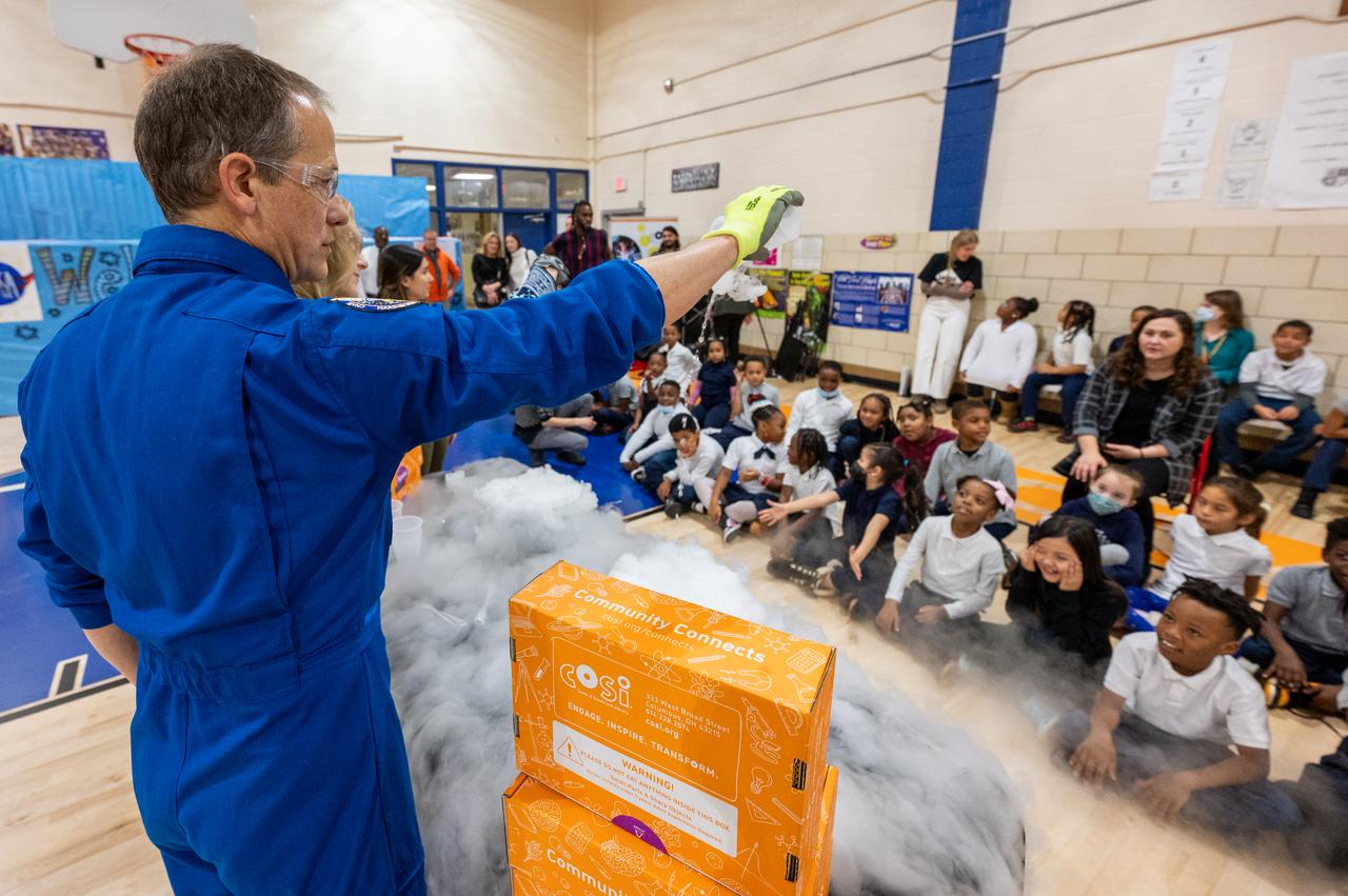 NASA astronaut Tom Marshburn is seen during science demonstrations as he and fellow crewmates Raja Chari, Kayla Barron, and Mark Vande Hei visit Amidon-Bowen Elementary School, Thursday, Dec. 8, 2022, in Washington. Vande Hei spent 355 days in space as a member of Expedition 65/66 and was joined during Expedition 66 by Marshburn, Chari, and Barron who spent 177 days onboard the International Space Station. Photo Credit: (NASA/Keegan Barber)