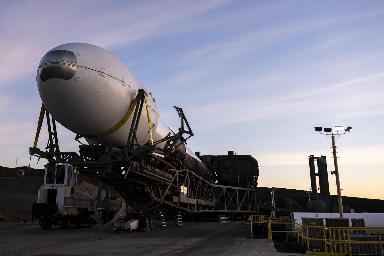 A SpaceX Falcon 9 rocket with the Surface Water and Ocean Topography (SWOT) spacecraft onboard is seen as it rolls out to the pad, Tuesday, Dec. 13, 2022, at Space Launch Complex 4E at Vandenberg Space Force Base in California. Jointly developed by NASA and Centre National D'Etudes Spatiales (CNES), with contributions from the Canadian Space Agency (CSA) and United Kingdom Space Agency, SWOT is the first satellite mission that will observe nearly all water on Earth’s surface, measuring the height of water in the planet’s lakes, rivers, reservoirs, and the ocean. Photo Credit: (NASA/Keegan Barber)