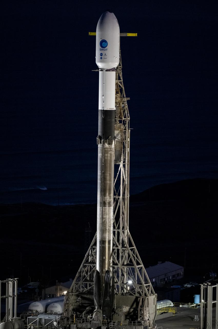 A SpaceX Falcon 9 rocket with the Surface Water and Ocean Topography (SWOT) spacecraft onboard is seen as preparations for launch continue, Wednesday, Dec. 14, 2022, at Space Launch Complex 4E at Vandenberg Space Force Base in California. Jointly developed by NASA and Centre National D'Etudes Spatiales (CNES), with contributions from the Canadian Space Agency (CSA) and United Kingdom Space Agency, SWOT is the first satellite mission that will observe nearly all water on Earth’s surface, measuring the height of water in the planet’s lakes, rivers, reservoirs, and the ocean. Photo Credit: (NASA/Keegan Barber)