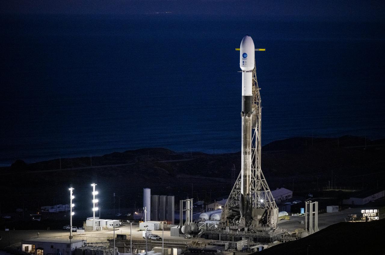 A SpaceX Falcon 9 rocket with the Surface Water and Ocean Topography (SWOT) spacecraft onboard is seen as preparations for launch continue, Wednesday, Dec. 14, 2022, at Space Launch Complex 4E at Vandenberg Space Force Base in California. Jointly developed by NASA and Centre National D'Etudes Spatiales (CNES), with contributions from the Canadian Space Agency (CSA) and United Kingdom Space Agency, SWOT is the first satellite mission that will observe nearly all water on Earth’s surface, measuring the height of water in the planet’s lakes, rivers, reservoirs, and the ocean. Photo Credit: (NASA/Keegan Barber)