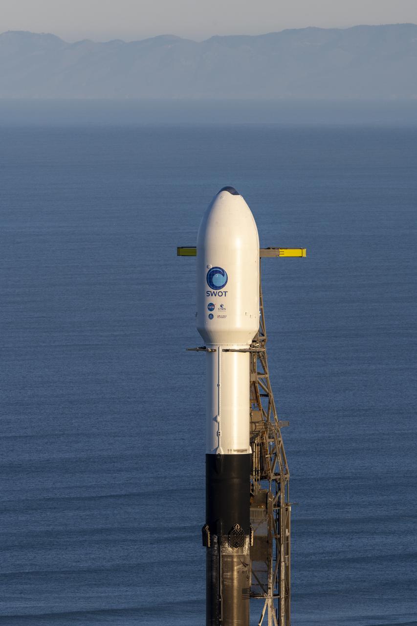 A SpaceX Falcon 9 rocket with the Surface Water and Ocean Topography (SWOT) spacecraft onboard is seen as preparations for launch continue, Wednesday, Dec. 14, 2022, at Space Launch Complex 4E at Vandenberg Space Force Base in California. Jointly developed by NASA and Centre National D'Etudes Spatiales (CNES), with contributions from the Canadian Space Agency (CSA) and United Kingdom Space Agency, SWOT is the first satellite mission that will observe nearly all water on Earth’s surface, measuring the height of water in the planet’s lakes, rivers, reservoirs, and the ocean. Photo Credit: (NASA/Keegan Barber)