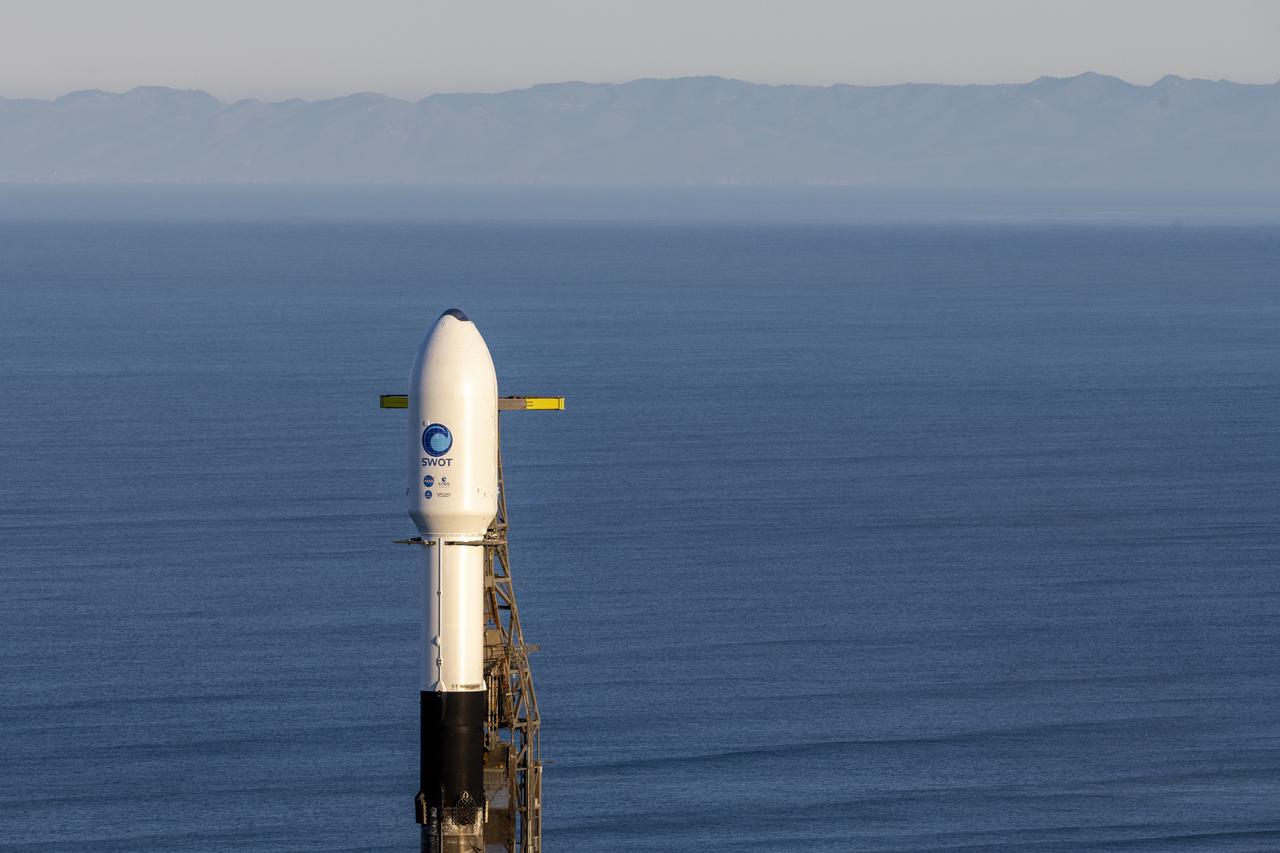 A SpaceX Falcon 9 rocket with the Surface Water and Ocean Topography (SWOT) spacecraft onboard is seen as preparations for launch continue, Wednesday, Dec. 14, 2022, at Space Launch Complex 4E at Vandenberg Space Force Base in California. Jointly developed by NASA and Centre National D'Etudes Spatiales (CNES), with contributions from the Canadian Space Agency (CSA) and United Kingdom Space Agency, SWOT is the first satellite mission that will observe nearly all water on Earth’s surface, measuring the height of water in the planet’s lakes, rivers, reservoirs, and the ocean. Photo Credit: (NASA/Keegan Barber)