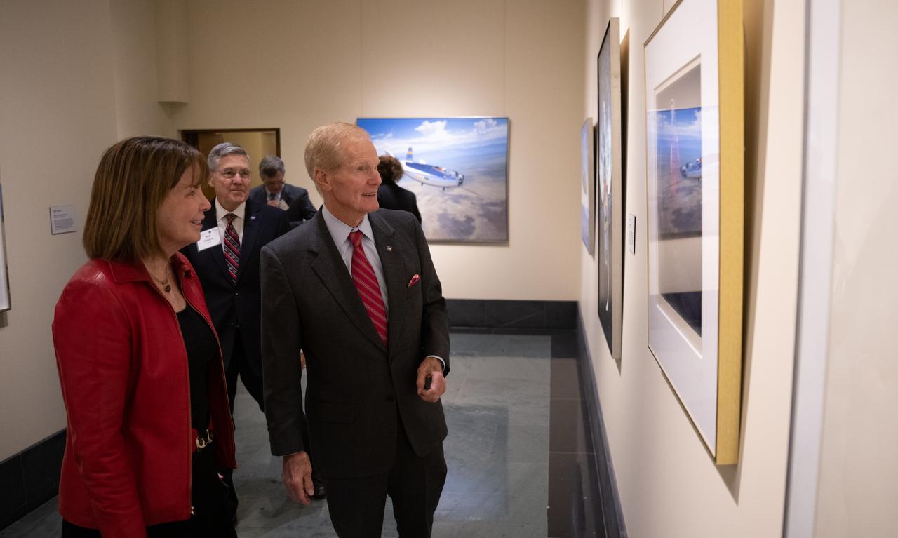 Colleen Hartman, director of physics, aeronautics, and space science at the National Academies of Science , left, and NASA Administrator Bill Nelson are seen as they view the NASA Art Program Exhibition “Launching the Future: Looking Back to Look Forward” during an event celebrating the 50th anniversary of the Apollo 17 mission, Wednesday, Dec. 14, 2022, at the National Academies of Science in Washington. The three-astronaut crew of Apollo 17 -  commander Eugene Cernan, lunar module pilot Harrison Schmitt, and command module pilot Ronald Evans, embarked on the last mission of the Apollo program to land humans on the Moon in December of 1972. Cernan and Schmitt spent three days on the lunar surface collecting samples and performing scientific experiments before lifting off from the Taurus-Littrow Valley on December 14, 1972.  Photo Credit: (NASA/Joel Kowsky)