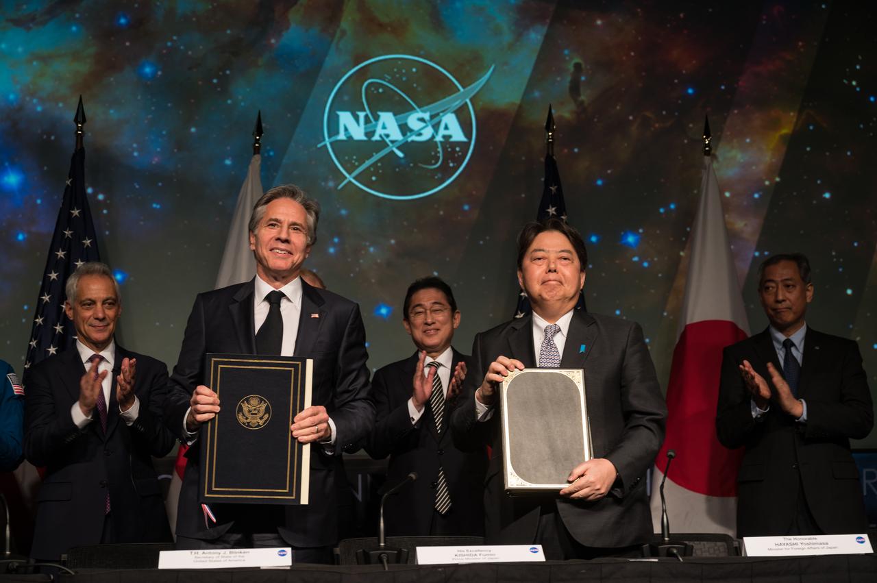 U.S. Secretary of State Antony Blinken, front left, and Japan’s Minister for Foreign Affairs, Hayashi Yoshimasa, front right, pose for a photo after signing an agreement that builds on a long history of collaboration in space exploration between the U.S. and Japan, Friday, Jan. 13, 2023, at the Mary W. Jackson NASA Headquarters building in Washington. Also present were, U.S. Ambassador to Japan Rahm Emanuel, left, NASA Administrator Bill Nelson, second from left, Prime Minister of Japan, His Excellency Kishida Fumio, second from right, President of the Japan Aerospace Exploration Agency (JAXA), Yamakawa Hiroshi, right. “The Framework Agreement Between the Government of Japan and the Government of the United States of America for Cooperation in Space Exploration and Use of Outer Space, Including the Moon and Other Celestial Bodies, For Peaceful Purposes” covers joint activities including space science, Earth science, space operations and exploration, aeronautical science and technology, space technology, space transportation, and safety and mission assurance, among others. Photo Credit: (NASA/Aubrey Gemignani)