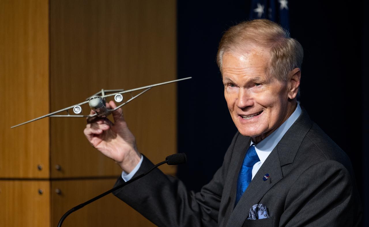 NASA Administrator Bill Nelson holds a model of an aircraft with a Transonic Truss-Braced Wing during a news conference on NASA’s Sustainable Flight Demonstrator project, Wednesday, Jan. 18, 2023, at the Mary W. Jackson NASA Headquarters building in Washington, DC.  Through a Funded Space Act Agreement, The Boeing company and its industry team will collaborate with NASA to develop and flight-test a full-scale Transonic Truss-Braced Wing demonstrator aircraft. Photo Credit: (NASA/Joel Kowsky)