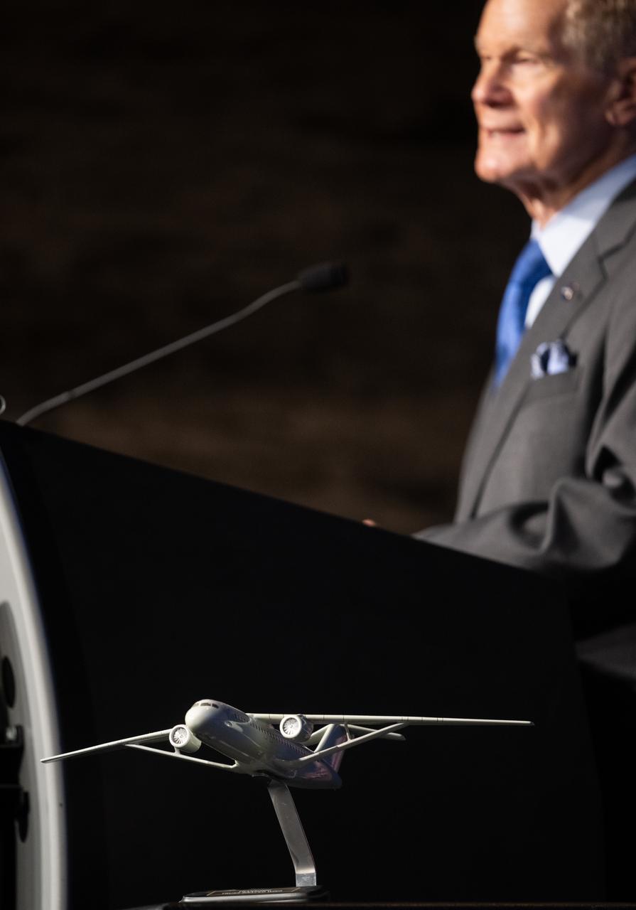 A model of an aircraft with a Transsonic Truss-Braced Wing is seen during a news conference on NASA’s Sustainable Flight Demonstrator project, Wednesday, Jan. 18, 2023, at the Mary W. Jackson NASA Headquarters building in Washington, DC.  Through a Funded Space Act Agreement, The Boeing company and its industry team will collaborate with NASA to develop and flight-test a full-scale Transonic Truss-Braced Wing demonstrator aircraft. Photo Credit: (NASA/Joel Kowsky)