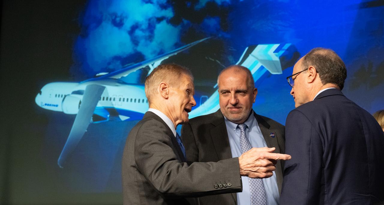 NASA Administrator Bill Nelson, left, Bob Pearce, associate administrator for NASA's Aeronautics Research Mission Directorate, center, and Todd Citron, chief technology officer, The Boeing Company, right, are seen following a news conference on NASA’s Sustainable Flight Demonstrator project, Wednesday, Jan. 18, 2023, at the Mary W. Jackson NASA Headquarters building in Washington, DC.  Through a Funded Space Act Agreement, The Boeing company and its industry team will collaborate with NASA to develop and flight-test a full-scale Transonic Truss-Braced Wing demonstrator aircraft. Photo Credit: (NASA/Joel Kowsky)