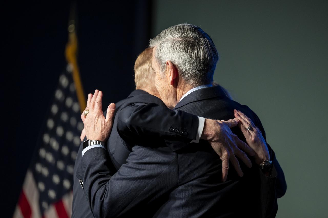 NASA Administrator Bill Nelson, NASA Deputy Administrator Pam Melroy, and NASA Associate Administrator Bob Cabana hug during the NASA Day of Remembrance Employee Safety Town Hall, Tuesday, Jan. 24, 2023, at the Mary W. Jackson NASA Headquarters building in Washington. Photo Credit: (NASA/Keegan Barber)
