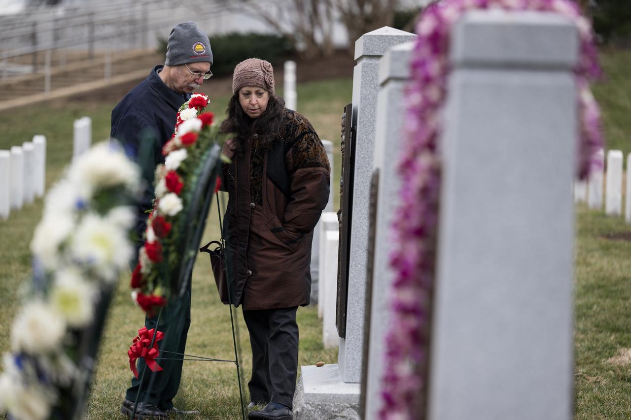 Challenger astronaut Judy Resnik’s brother Chuck and her sister-in-law Amy, visit the Space Shuttle Challenger Memorial after a wreath laying ceremony that was part of NASA's Day of Remembrance, Thursday, Jan. 26, 2023, at Arlington National Cemetery in Arlington, Va. Wreaths were laid in memory of those men and women who lost their lives in the quest for space exploration.  Photo Credit: (NASA/Aubrey Gemignani)