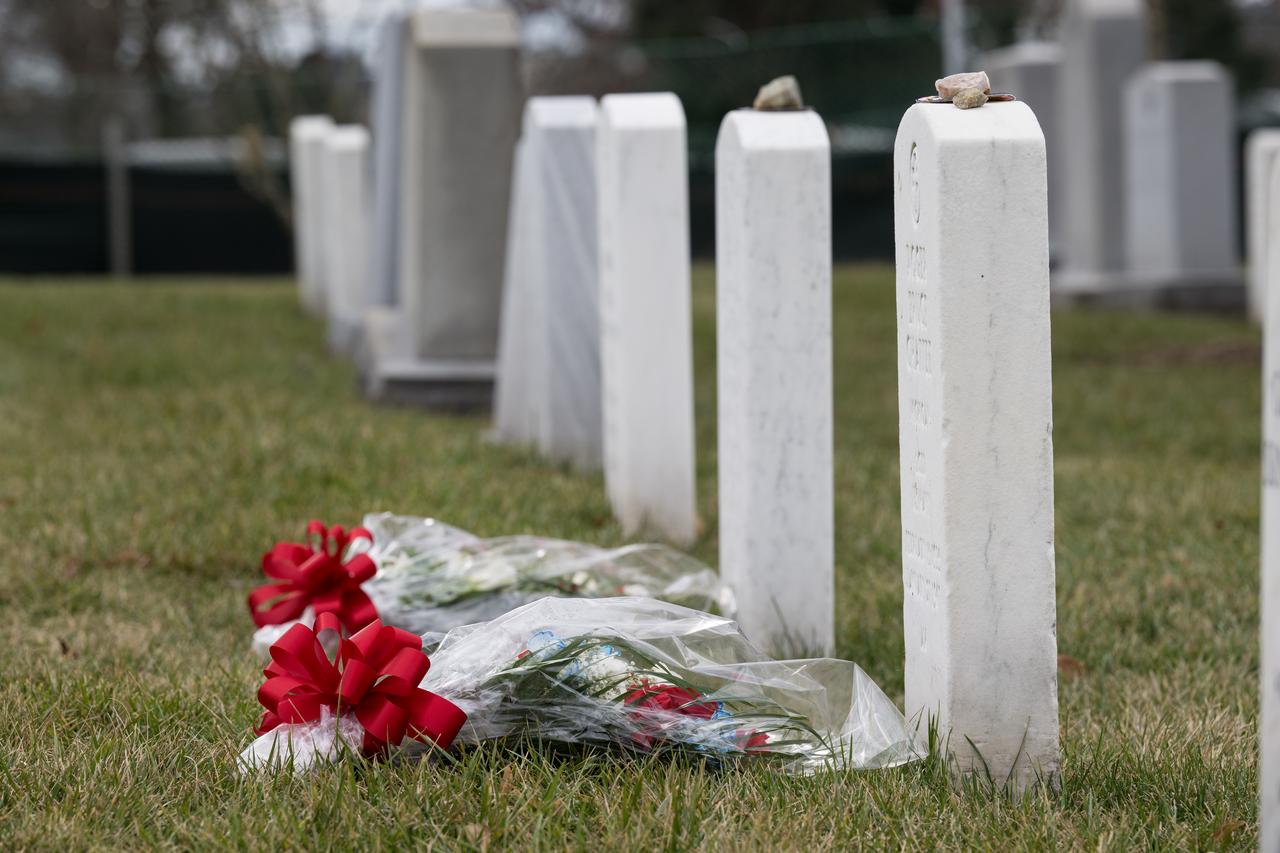 Flowers are seen at the grave markers of Virgil "Gus" Grissom and Roger Chaffee from Apollo 1 after NASA Administrator Bill Nelson placed them there during a ceremony that was part of NASA's Day of Remembrance, Thursday, Jan. 26, 2023, at Arlington National Cemetery in Arlington, Va.  Wreaths were laid in memory of those men and women who lost their lives in the quest for space exploration.  Photo Credit: (NASA/Aubrey Gemignani)