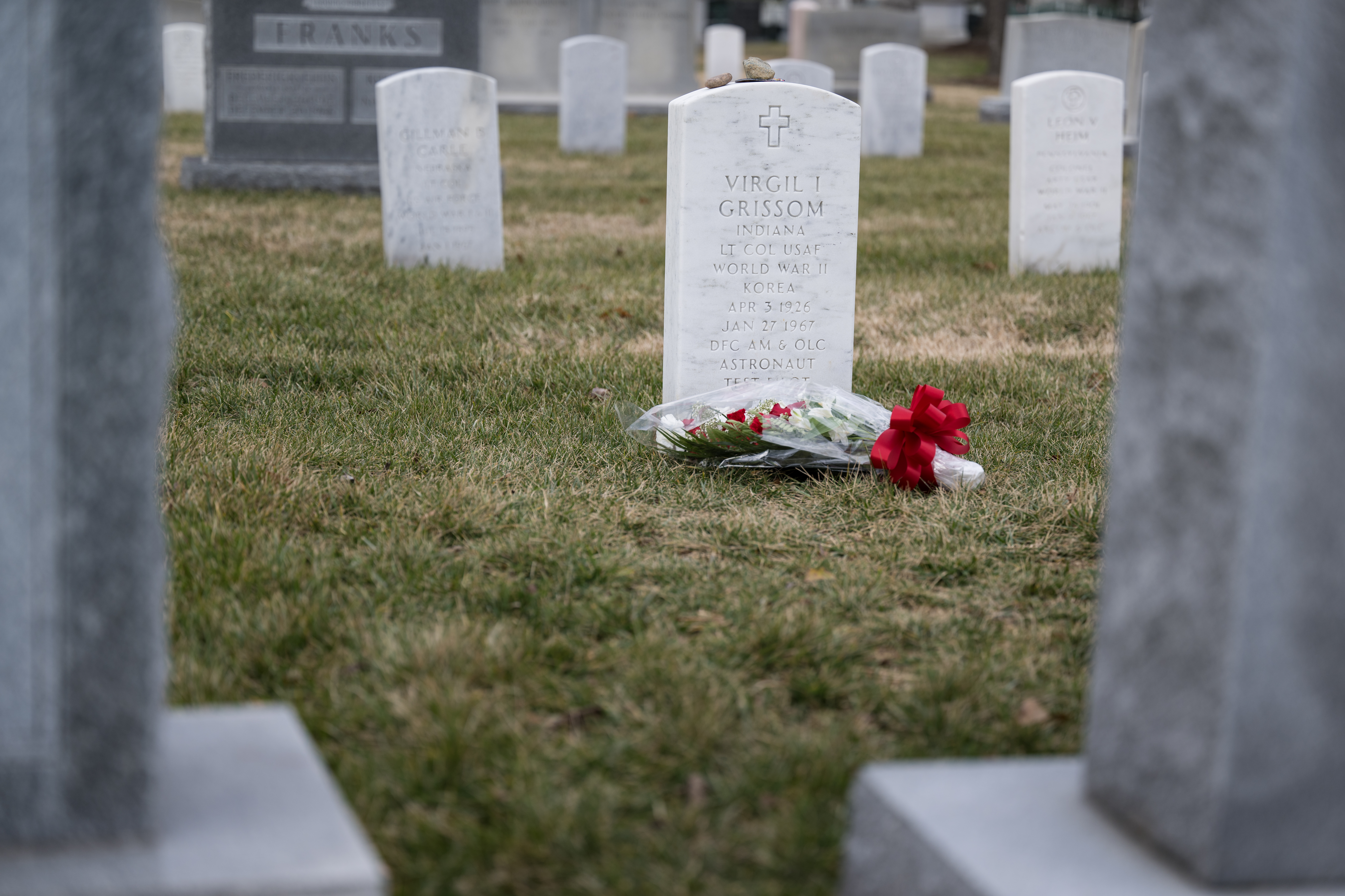 The grave marker of Virgil "Gus" Grissom from Apollo 1, is seen after a wreath laying ceremony that was part of NASA's Day of Remembrance, Thursday, Jan. 26, 2023, at Arlington National Cemetery in Arlington, Va.  Wreaths and flowers were laid in memory of those men and women who lost their lives in the quest for space exploration.  Photo Credit: (NASA/Aubrey Gemignani)