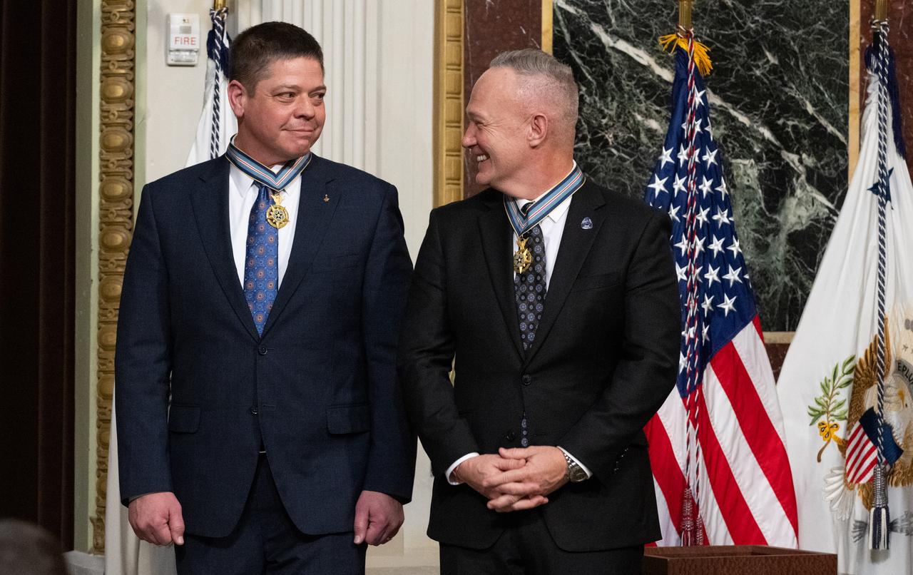 Former NASA astronauts Robert Behnken, left, and Douglas Hurley, right, are seen after being awarded the Congressional Space Medal of Honor by Vice President Kamala Harris during a ceremony in the Indian Treaty Room of the Eisenhower Executive Office Building, Tuesday, Jan. 31, 2023, in Washington. Former astronauts Behnken and Hurley were awarded the Congressional Space Medal of Honor for their bravery in NASA’s SpaceX Demonstration Mission-2 to the International Space Station in 2020, the first crewed flight as part of the agency’s Commercial Crew Program. Photo Credit: (NASA/Joel Kowsky)