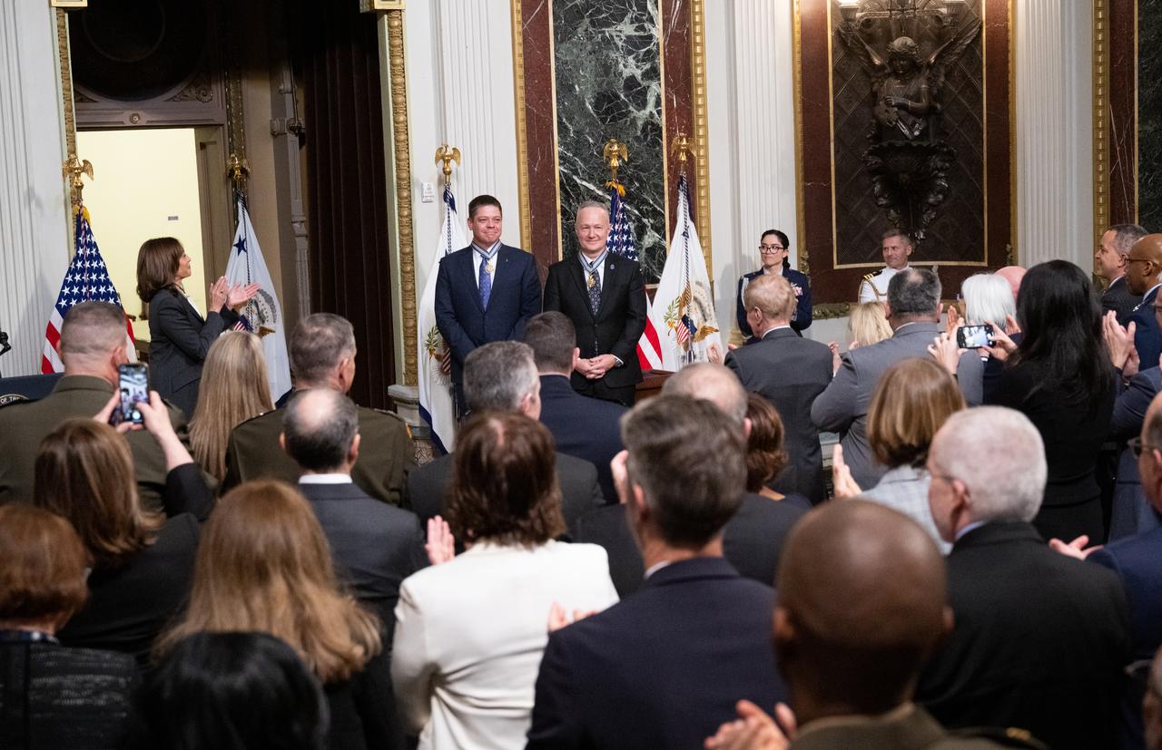 Vice President Kamala Harris, left, congratulates former NASA astronauts Robert Behnken, second from right, and Douglas Hurley, right, after being awarded the Congressional Space Medal of Honor during a ceremony in the Indian Treaty Room of the Eisenhower Executive Office Building, Tuesday, Jan. 31, 2023, in Washington. Former astronauts Behnken and Hurley were awarded the Congressional Space Medal of Honor for their bravery in NASA’s SpaceX Demonstration Mission-2 to the International Space Station in 2020, the first crewed flight as part of the agency’s Commercial Crew Program. Photo Credit: (NASA/Joel Kowsky)
