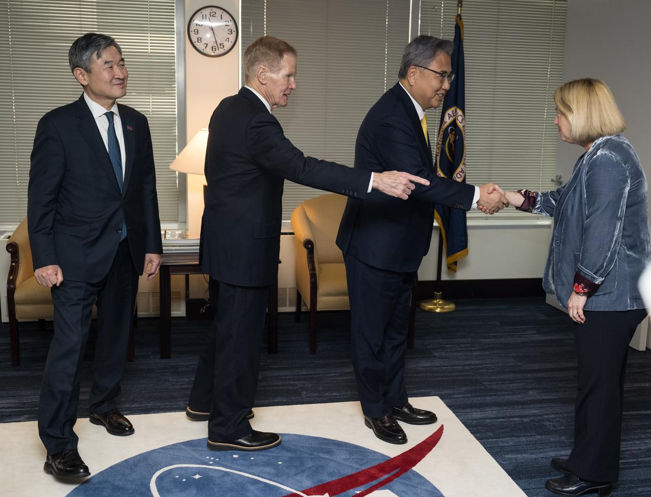NASA Deputy Administrator Pam Melroy, right, greets Republic of Korea Minister of Foreign Affairs, Jin Park, as Republic of Korea Ambassador to the U.S. Taeyong Cho, left, and NASA Administrator Bill Nelson look on, Thursday, Feb. 2, 2023 at the Mary W. Jackson NASA Headquarters building in Washington DC. Photo Credit: (NASA/Aubrey Gemignani)