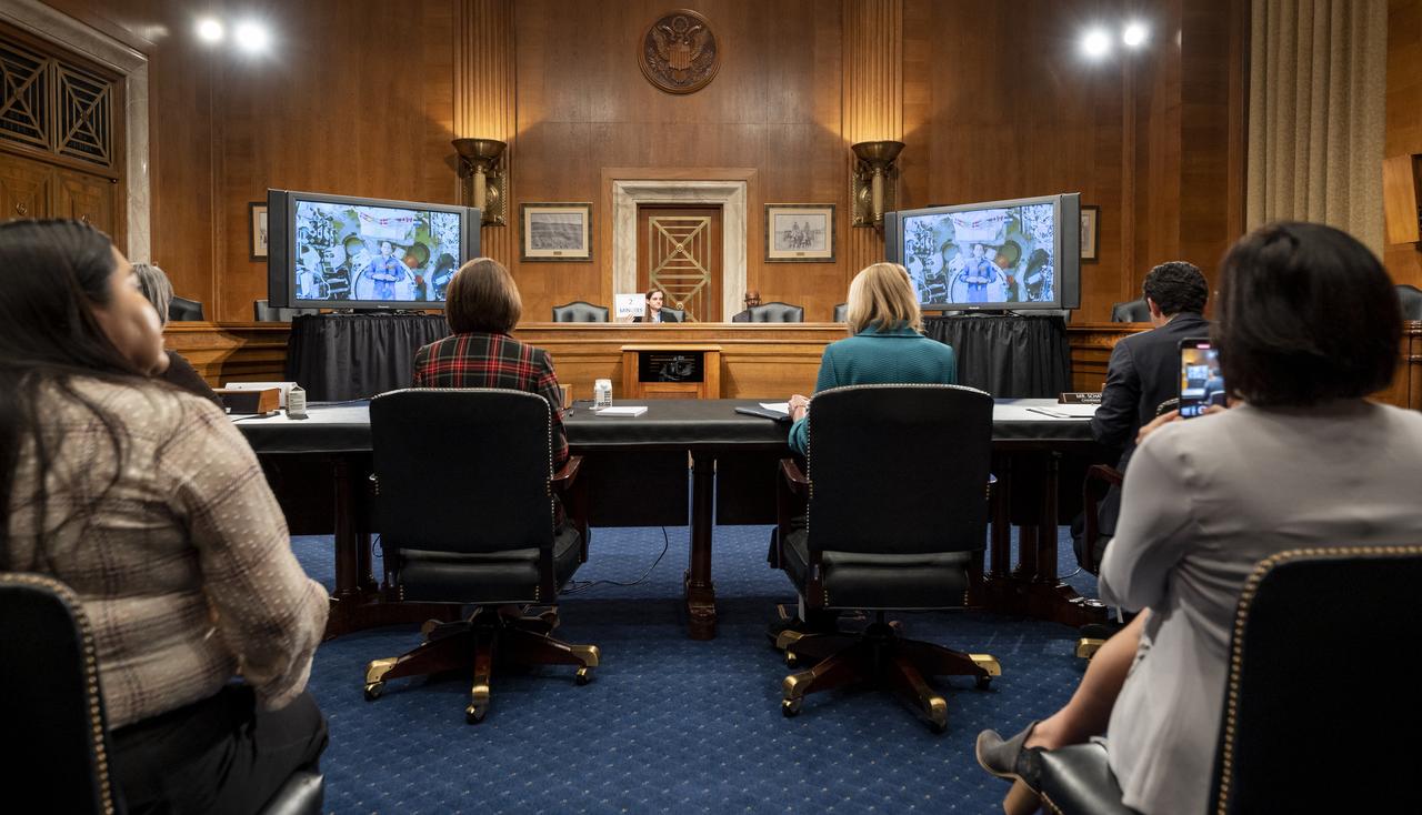NASA astronaut Nicole Mann, Expedition 68 Flight Engineer, is seen from onboard the International Space Station (ISS) during a briefing with members of the House of Representatives, the Indian Affairs Committee, and the Senate Native American Affairs Committee, Tuesday, Feb. 7, 2023, at the Dirksen Senate Office Building in Washington.  Mann answered questions from members of the committees during a live downlink from the International Space Station. Photo Credit: (NASA/Keegan Barber)