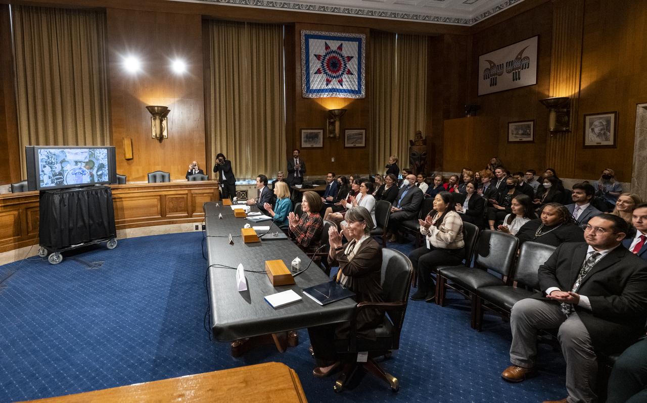 NASA astronaut Nicole Mann, Expedition 68 Flight Engineer, is seen from onboard the International Space Station (ISS) during a briefing with members of the House of Representatives, the Indian Affairs Committee, and the Senate Native American Affairs Committee, Tuesday, Feb. 7, 2023, at the Dirksen Senate Office Building in Washington.  Mann answered questions from members of the committees during a live downlink from the International Space Station. Photo Credit: (NASA/Keegan Barber)