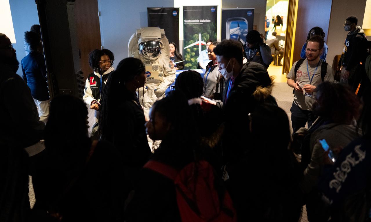 Students from local schools take pictures with an individual wearing a space suit as they view STEM exhibits during an event celebrating Black History Month at the Smithsonian National Museum of African American History and Culture, Friday, Feb. 10, 2023, in Washington. Photo Credit: (NASA/Joel Kowsky)