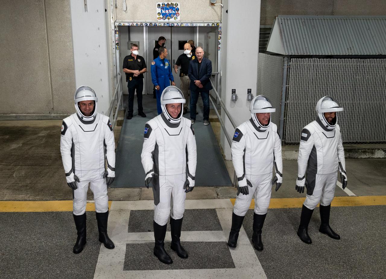 Roscosmos cosmonaut Andrey Fedyaev, NASA astronaut Warren “Woody" Hoburg, second from left, NASA astronaut Stephen Bowen, second from right, and UAE (United Arab Emirates) astronaut Sultan Alneyadi, right, wearing SpaceX spacesuits, are seen as they prepare to depart the Neil  A. Armstrong Operations and Checkout Building for Launch Complex 39A during a dress rehearsal prior to the Crew-6 mission launch, Thursday, Feb. 23, 2023, at NASA’s Kennedy Space Center in Florida. NASA’s SpaceX Crew-6 mission is the sixth crew rotation mission of the SpaceX Dragon spacecraft and Falcon 9 rocket to the International Space Station as part of the agency’s Commercial Crew Program. Bowen, Hoburg, Alneyadi, and Fedyaev are scheduled to launch at 1:45 a.m. EST on Feb. 27, from Launch Complex 39A at the Kennedy Space Center. Photo Credit: (NASA/Joel Kowsky)