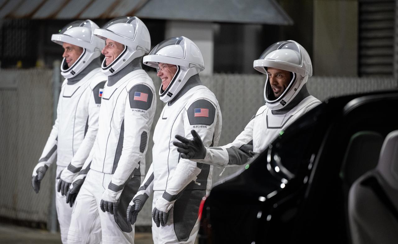 Roscosmos cosmonaut Andrey Fedyaev, NASA astronaut Warren “Woody" Hoburg, second from left, NASA astronaut Stephen Bowen, second from right, and UAE (United Arab Emirates) astronaut Sultan Alneyadi, right, wearing SpaceX spacesuits, are seen as they prepare to depart the Neil  A. Armstrong Operations and Checkout Building for Launch Complex 39A during a dress rehearsal prior to the Crew-6 mission launch, Thursday, Feb. 23, 2023, at NASA’s Kennedy Space Center in Florida. NASA’s SpaceX Crew-6 mission is the sixth crew rotation mission of the SpaceX Dragon spacecraft and Falcon 9 rocket to the International Space Station as part of the agency’s Commercial Crew Program. Bowen, Hoburg, Alneyadi, and Fedyaev are scheduled to launch at 1:45 a.m. EST on Feb. 27, from Launch Complex 39A at the Kennedy Space Center. Photo Credit: (NASA/Joel Kowsky)