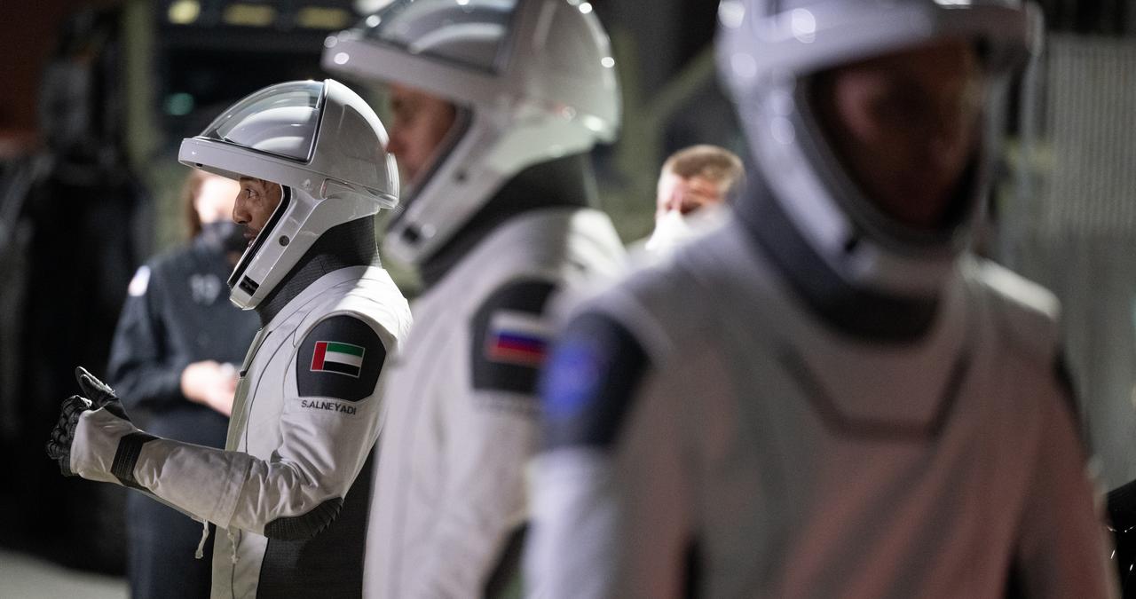 UAE (United Arab Emirates) astronaut Sultan Alneyadi gives a thumbs up as he and NASA astronauts Stephen Bowen and Warren "Woody" Hoburg, and Roscosmos cosmonaut Andrey Fedyaev, wearing SpaceX spacesuits, prepare to depart the Neil  A. Armstrong Operations and Checkout Building for Launch Complex 39A during a dress rehearsal prior to the Crew-6 mission launch, Thursday, Feb. 23, 2023, at NASA’s Kennedy Space Center in Florida. NASA’s SpaceX Crew-6 mission is the sixth crew rotation mission of the SpaceX Dragon spacecraft and Falcon 9 rocket to the International Space Station as part of the agency’s Commercial Crew Program. Bowen, Hoburg, Alneyadi, and Fedyaev are scheduled to launch at 1:45 a.m. EST on Feb. 27, from Launch Complex 39A at the Kennedy Space Center. Photo Credit: (NASA/Joel Kowsky)