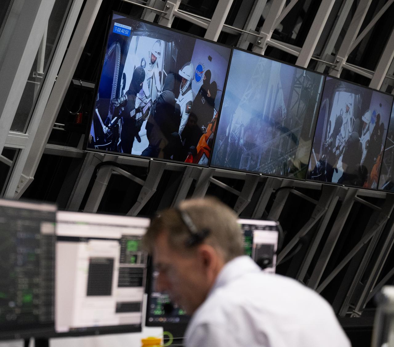 Roscosmos cosmonaut Andrey Fedyaev and UAE (United Arab Emirates) astronaut Sultan Alneyadi are seen on a monitor while they prepare to board the Dragon spacecraft as NASA and SpaceX teams monitor the countdown during a dress rehearsal in preparation for the launch of a SpaceX Falcon 9 rocket carrying the company's Dragon spacecraft on NASA’s SpaceX Crew-6 mission with NASA astronauts Stephen Bowen and Warren "Woody" Hoburg, UAE (United Arab Emirates) astronaut Sultan Alneyadi, and Roscosmos cosmonaut Andrey Fedyaev onboard, Thursday, Feb. 23, 2023, in firing room four of the Rocco A. Petrone Launch Control Center at NASA’s Kennedy Space Center in Florida. NASA’s SpaceX Crew-6 mission is the sixth crew rotation mission of the SpaceX Dragon spacecraft and Falcon 9 rocket to the International Space Station as part of the agency’s Commercial Crew Program. Bowen, Hoburg, Alneyadi, and Fedyaev are scheduled to launch at 1:45 a.m. EST on Feb. 27, from Launch Complex 39A at the Kennedy Space Center. Photo Credit: (NASA/Joel Kowsky)