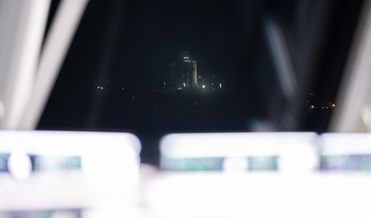 A SpaceX Falcon 9 rocket and Dragon spacecraft are seen through the windows of firing room four during a dress rehearsal in preparation for the launch of NASA’s SpaceX Crew-6 mission with NASA astronauts Stephen Bowen and Warren "Woody" Hoburg, UAE (United Arab Emirates) astronaut Sultan Alneyadi, and Roscosmos cosmonaut Andrey Fedyaev onboard, Thursday, Feb. 23, 2023, in the Rocco A. Petrone Launch Control Center at NASA’s Kennedy Space Center in Florida. NASA’s SpaceX Crew-6 mission is the sixth crew rotation mission of the SpaceX Dragon spacecraft and Falcon 9 rocket to the International Space Station as part of the agency’s Commercial Crew Program. Bowen, Hoburg, Alneyadi, and Fedyaev are scheduled to launch at 1:45 a.m. EST on Feb. 27, from Launch Complex 39A at the Kennedy Space Center. Photo Credit: (NASA/Joel Kowsky)