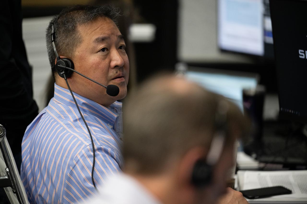 Ven Feng, deputy program manager for NASA's Commercial Crew Program, monitors the countdown during a dress rehearsal in preparation for the launch of a SpaceX Falcon 9 rocket carrying the company's Dragon spacecraft on NASA’s SpaceX Crew-6 mission with NASA astronauts Stephen Bowen and Warren "Woody" Hoburg, UAE (United Arab Emirates) astronaut Sultan Alneyadi, and Roscosmos cosmonaut Andrey Fedyaev onboard, Thursday, Feb. 23, 2023, in firing room four of the Rocco A. Petrone Launch Control Center at NASA’s Kennedy Space Center in Florida. NASA’s SpaceX Crew-6 mission is the sixth crew rotation mission of the SpaceX Dragon spacecraft and Falcon 9 rocket to the International Space Station as part of the agency’s Commercial Crew Program. Bowen, Hoburg, Alneyadi, and Fedyaev are scheduled to launch on 1:45 a.m. EST on Feb. 27, from Launch Complex 39A at the Kennedy Space Center. Photo Credit: (NASA/Joel Kowsky)