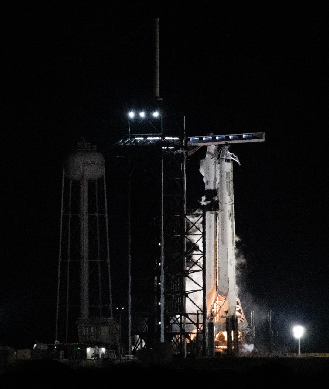 A SpaceX Falcon 9 rocket with the company's Dragon spacecraft onboard is seen on the launch pad at Launch Complex 39A during a brief static fire test ahead of NASA’s SpaceX Crew-6 mission, Friday, Feb. 24, 2023, at the agency’s Kennedy Space Center in Florida. NASA’s SpaceX Crew-6 mission is the sixth crew rotation mission of the SpaceX Dragon spacecraft and Falcon 9 rocket to the International Space Station as part of the agency’s Commercial Crew Program. NASA astronauts Stephen Bowen and Warren "Woody" Hoburg, UAE (United Arab Emirates) astronaut Sultan Alneyadi, and Roscosmos cosmonaut Andrey Fedyaev are scheduled to launch at 1:45 a.m. EST on Feb. 27, from Launch Complex 39A at the Kennedy Space Center. Photo Credit: (NASA/Joel Kowsky)