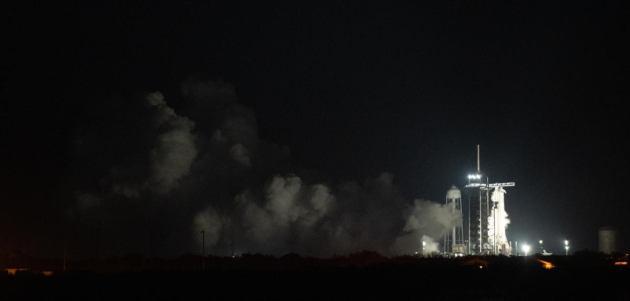 A SpaceX Falcon 9 rocket with the company's Dragon spacecraft onboard is seen on the launch pad at Launch Complex 39A during a brief static fire test ahead of NASA’s SpaceX Crew-6 mission, Friday, Feb. 24, 2023, at the agency’s Kennedy Space Center in Florida. NASA’s SpaceX Crew-6 mission is the sixth crew rotation mission of the SpaceX Dragon spacecraft and Falcon 9 rocket to the International Space Station as part of the agency’s Commercial Crew Program. NASA astronauts Stephen Bowen and Warren "Woody" Hoburg, UAE (United Arab Emirates) astronaut Sultan Alneyadi, and Roscosmos cosmonaut Andrey Fedyaev are scheduled to launch at 1:45 a.m. EST on Feb. 27, from Launch Complex 39A at the Kennedy Space Center. Photo Credit: (NASA/Joel Kowsky)