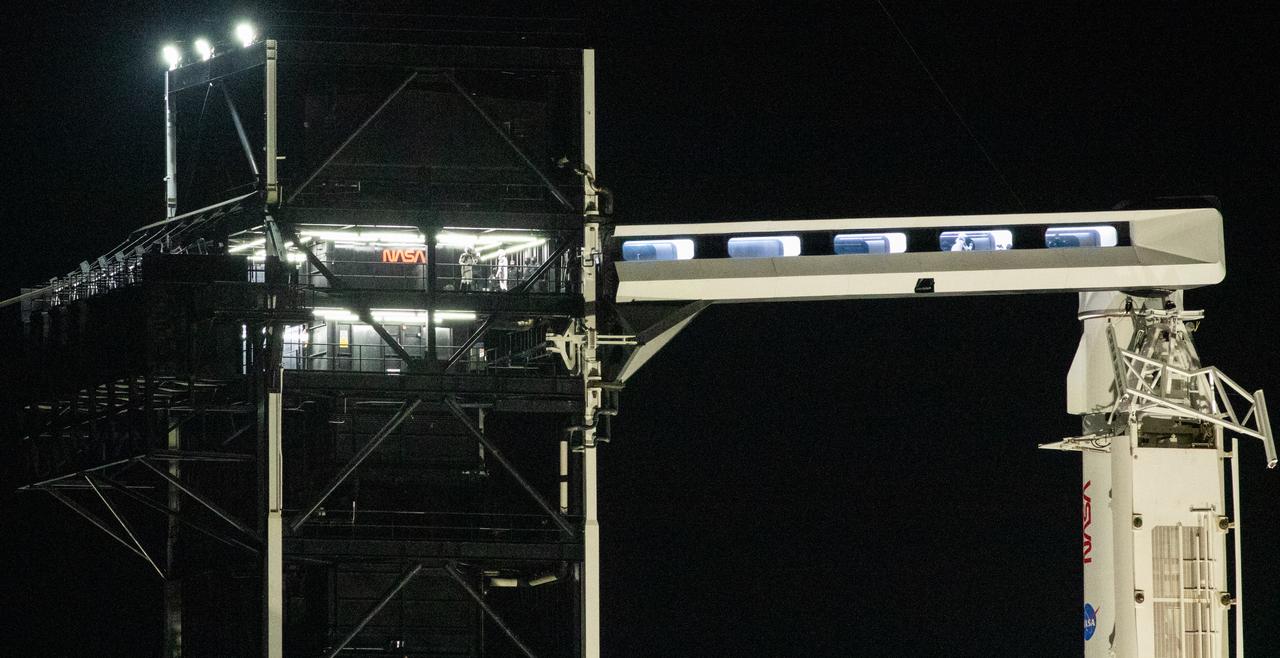 NASA astronauts Stephen Bowen and Warren "Woody" Hoburg are seen in the crew access arm as fellow crewmates Roscosmos cosmonaut Andrey Fedyaev and UAE (United Arab Emirates) astronaut Sultan Alneyadi are seen on the fixed service structure of Launch Complex 39A before boarding SpaceX’s Dragon spacecraft atop the company’s Falcon 9 rocket before the launch of NASA’s SpaceX Crew-6 mission to the International Space Station, Wednesday, March 1, 2023, at NASA’s Kennedy Space Center in Florida. NASA’s SpaceX Crew-6 mission is the sixth crew rotation mission of the SpaceX Dragon spacecraft and Falcon 9 rocket to the International Space Station as part of the agency’s Commercial Crew Program. Bowen, Hoburg, Roscosmos cosmonaut Andrey Fedyaev, and UAE (United Arab Emirates) astronaut Sultan Alneyadi launched at 12:34 a.m. EST from Launch Complex 39A at the Kennedy Space Center to begin a six month mission aboard the orbital outpost. Photo Credit: (NASA/Joel Kowsky)