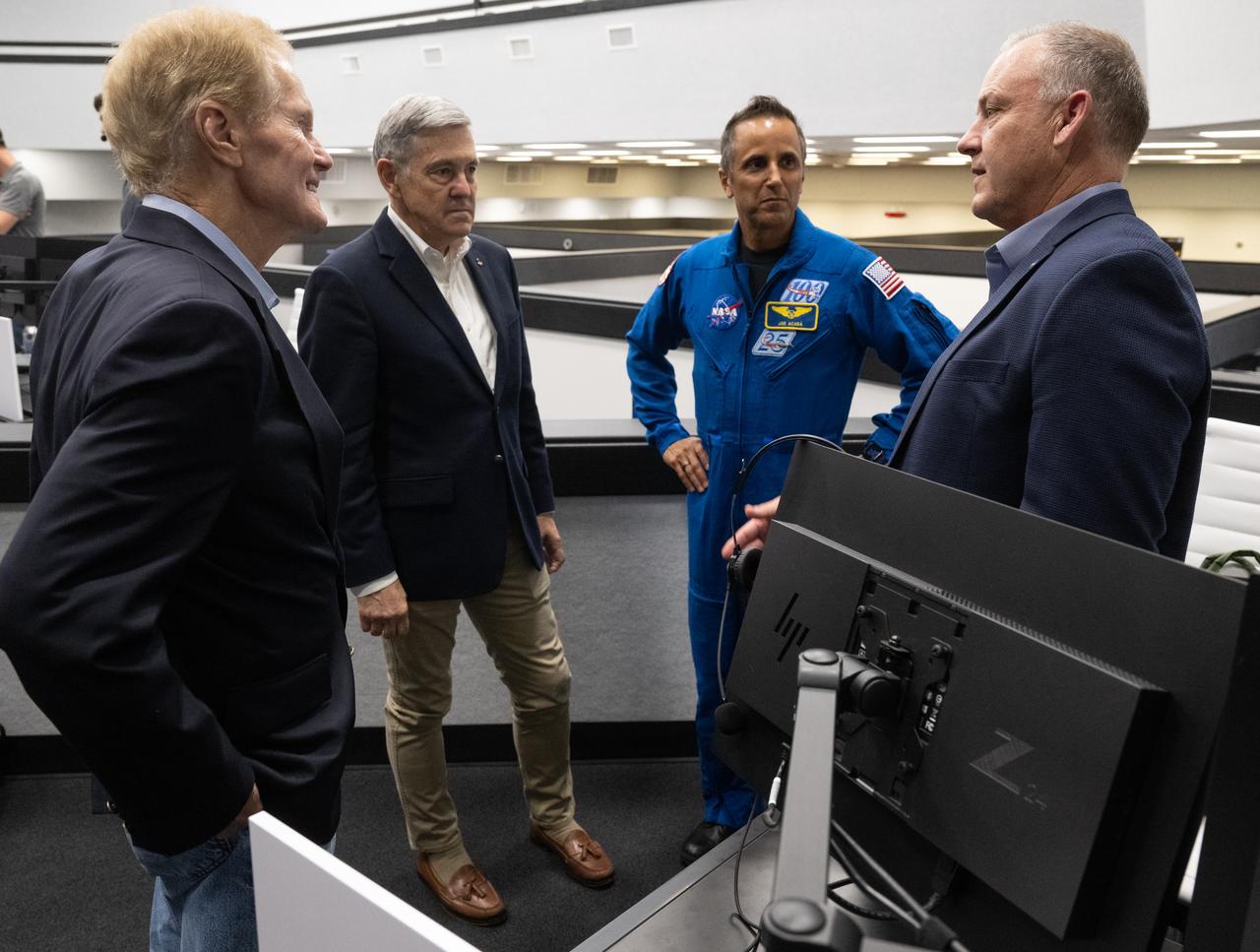 NASA Administrator Bill Nelson, left, Bob Cabana, NASA associate administrator, second from left, Joe Acaba, Chief of the Astronaut Office, second from right, and Norm Knight, director of Flight Operations at NASA's Johnson Space Center, right, are seen following the launch of a SpaceX Falcon 9 rocket carrying the company's Dragon spacecraft on the Crew-6 mission with NASA astronauts Stephen Bowen and Warren "Woody" Hoburg, UAE (United Arab Emirates) astronaut Sultan Alneyadi, and Roscosmos cosmonaut Andrey Fedyaev onboard, Thursday, March 2, 2023, in  firing room four of the Rocco A. Petrone Launch Control Center at NASA’s Kennedy Space Center in Florida. NASA’s SpaceX Crew-6 mission is the sixth crew rotation mission of the SpaceX Dragon spacecraft and Falcon 9 rocket to the International Space Station as part of the agency’s Commercial Crew Program. Bowen, Hoburg, Alneyadi, and Fedyaev launched at 12:34 a.m. EST, from Launch Complex 39A at the Kennedy Space Center to begin a six month mission aboard the International Space Station. Photo Credit: (NASA/Joel Kowsky)