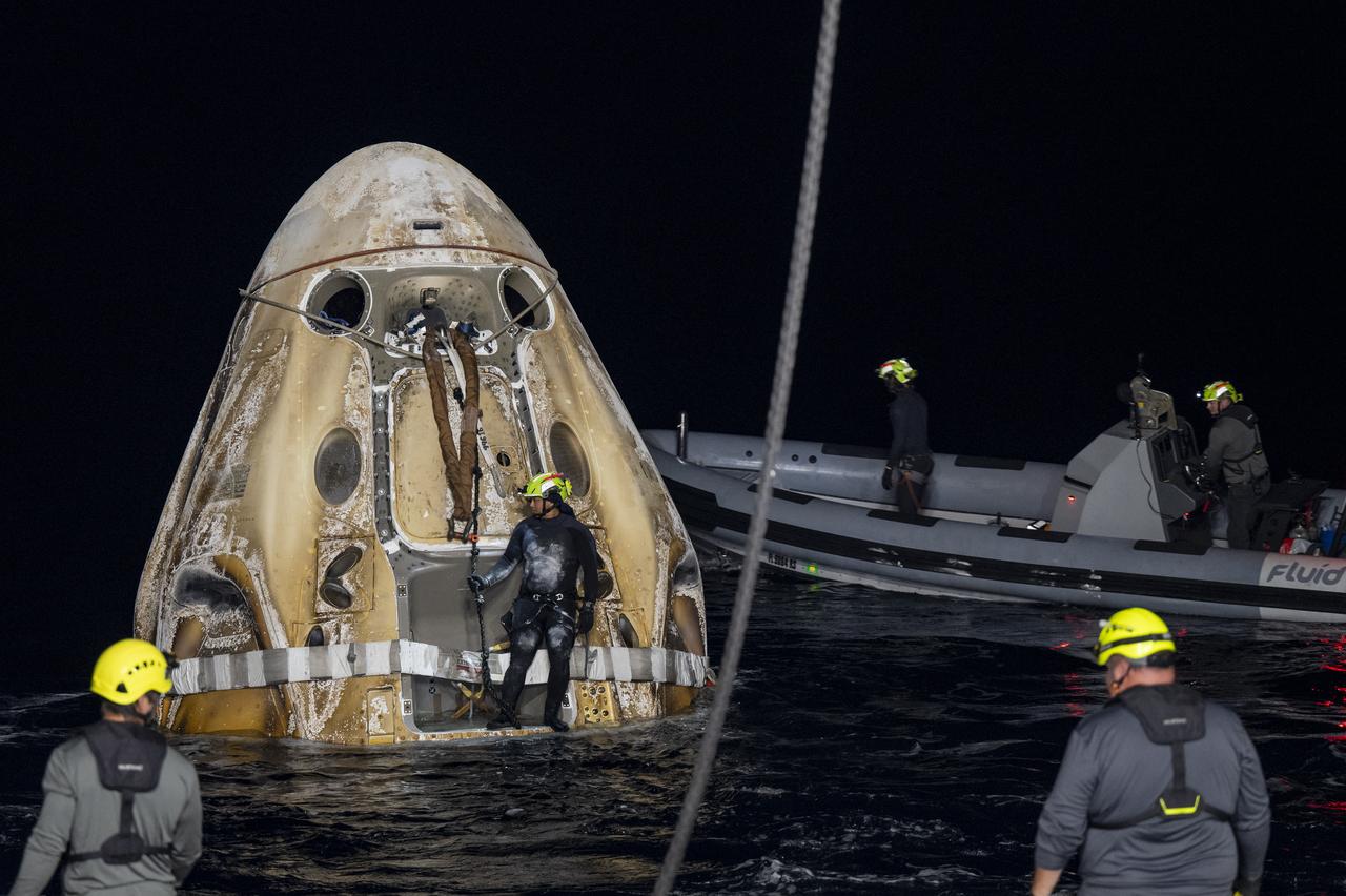 Support teams work around the SpaceX Dragon Endurance spacecraft shortly after it landed with with NASA astronauts Nicole Mann and Josh Cassada, Japan Aerospace Exploration Agency (JAXA) astronaut Koichi Wakata, and Roscosmos cosmonaut Anna Kikina onboard in the Gulf of Mexico off the coast of Tampa, Florida, Saturday, March 11, 2023. Mann, Cassada, Wakata, and Kikina are returning after 157 days in space as part of Expedition 68 aboard the International Space Station. Photo Credit: (NASA/Keegan Barber).
