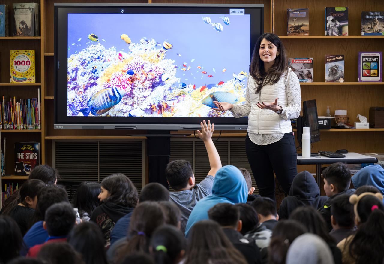 NASA Technical Group Supervisor for Sequence Planning and Execution and Tactical Mission Lead for the Mars Perseverance rover, Diana Trujillo, speaks to students at Rolling Terrace Elementary School, Monday, March 13, 2023, in Takoma Park, Maryland. Photo Credit: (NASA/Aubrey Gemignani)