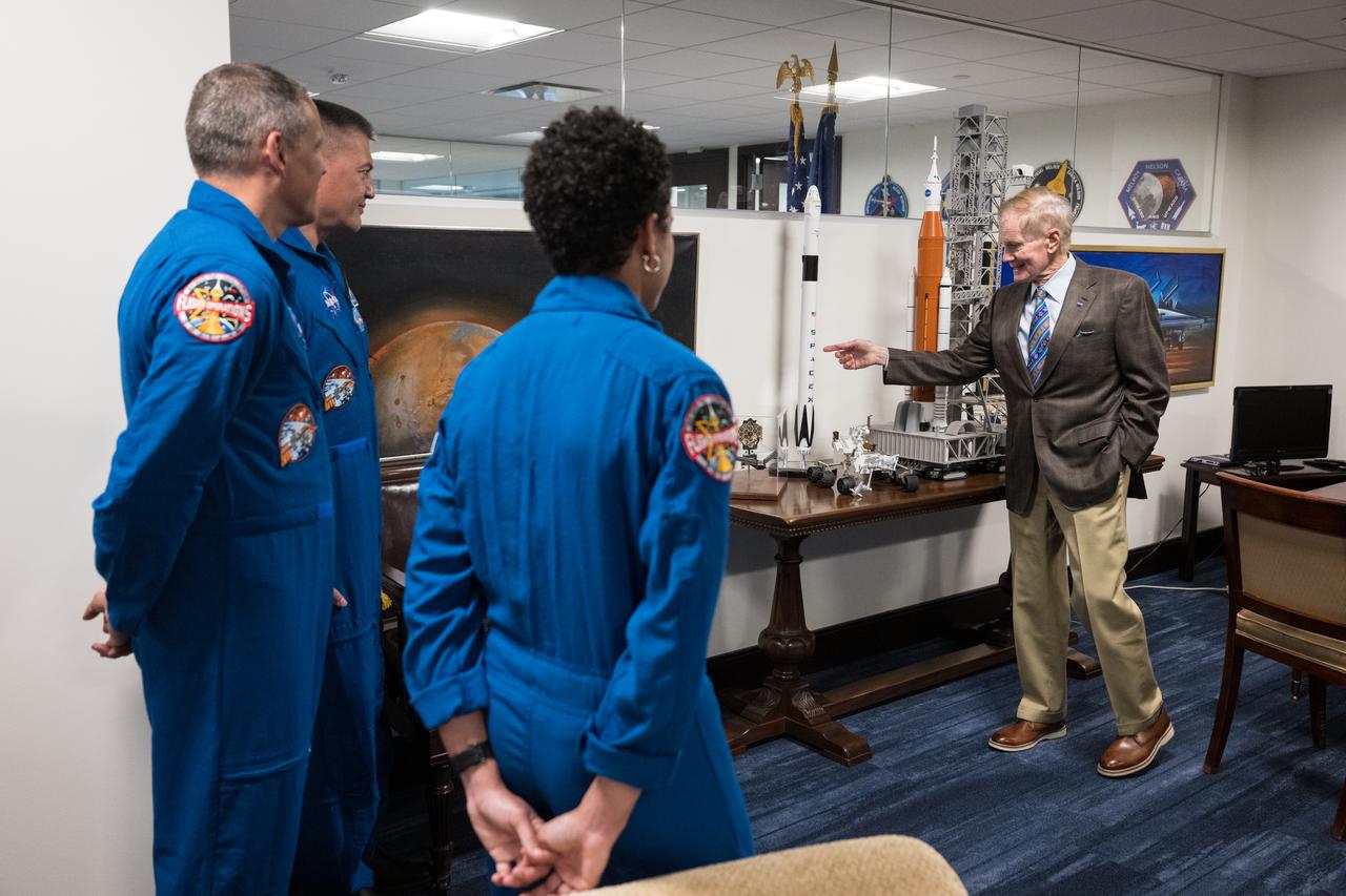 NASA’s SpaceX Crew-4 NASA astronauts Jessica Watkins, Robert Hines, and Kjell Lindgren look on as NASA Administrator Bill Nelson shows other visitors a model of the SpaceX Falcon 9 rocket that carried Crew-4 to the International Space Station, Monday, March 27, 2023, at the Mary W. Jackson NASA Headquarters building in Washington DC. Photo Credit: (NASA/Aubrey Gemignani)