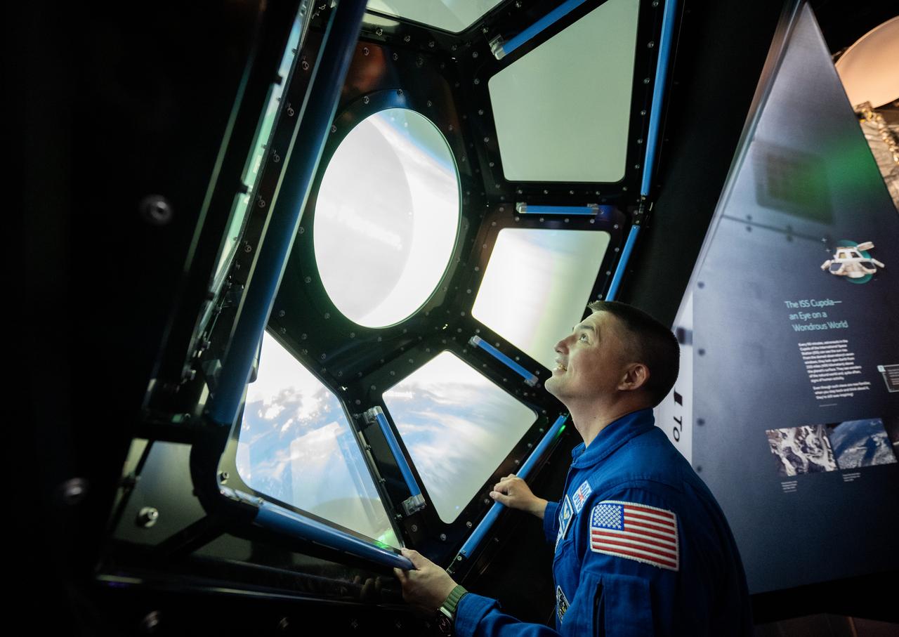 NASA astronaut Kjell Lindgren are seen in the in the One World Connected gallery looking at an interactive recreation of the International Space Station’s Cupola, Tuesday, March 28, 2023 at the Smithsonian’s National Air and Space Museum in Washington. Lindgren, along with fellow NASA astronauts Robert Hines and Jessica Watkins spent 170 days in space as part of Expeditions 67 and 68 aboard the International Space Station. Photo Credit: (NASA/Joel Kowsky)