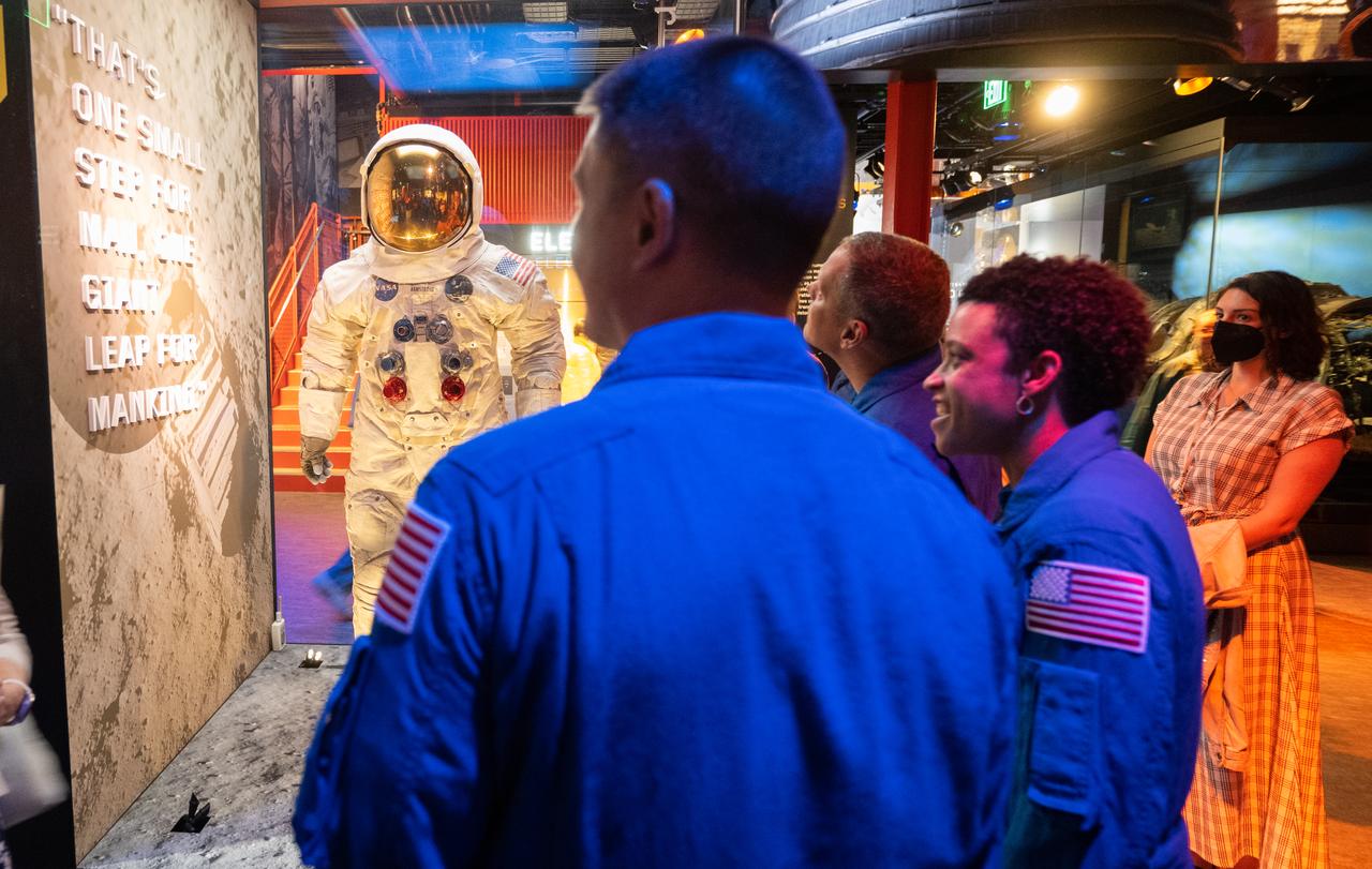 NASA astronauts Kjell Lindgren, Jessica Watkins, and Robert Hines are seen with Neil Armstrong’s A7-L pressure suit from the Apollo 11 mission in the Destination Moon exhibit during a tour, Tuesday, March 28, 2023 at the Smithsonian’s National Air and Space Museum in Washington. Lindgren, Hines, and Watkins spent 170 days in space as part of Expeditions 67 and 68 aboard the International Space Station. Photo Credit: (NASA/Joel Kowsky)