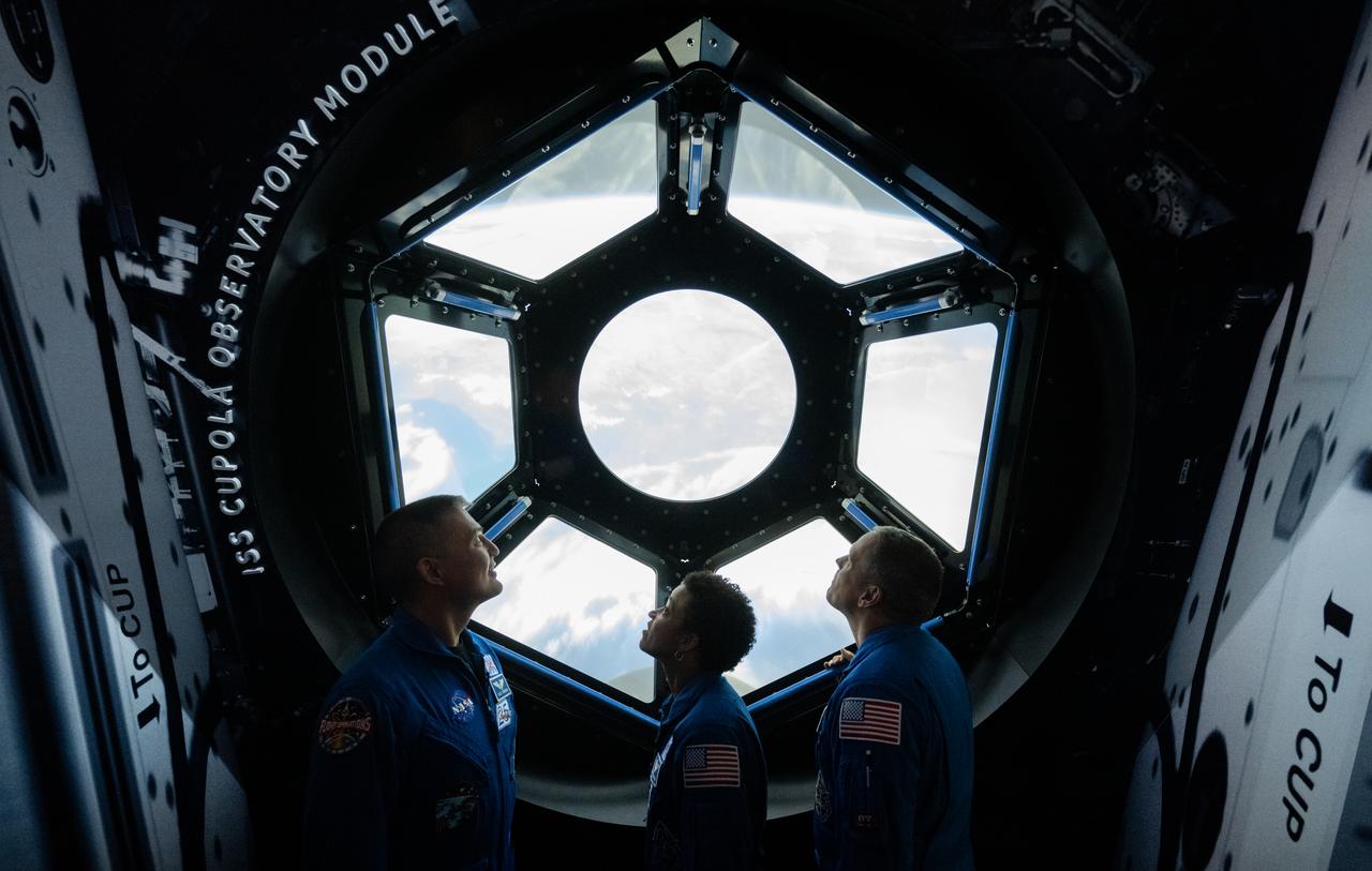 NASA astronauts Kjell Lindgren, left, Jessica Watkins, center, and Robert Hines, right, are seen in the in the One World Connected gallery looking at an interactive recreation of the International Space Station’s Cupola, Tuesday, March 28, 2023 at the Smithsonian’s National Air and Space Museum in Washington. Lindgren, Watkins, and Hines spent 170 days in space as part of Expeditions 67 and 68 aboard the International Space Station. Photo Credit: (NASA/Joel Kowsky)